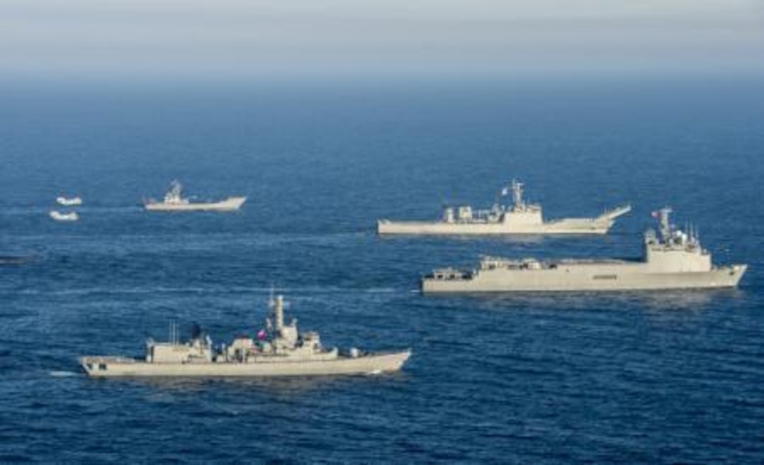 The Chilean ships Rancagua, Almirante Riveros and Sargento Aldea sail alongside the Mexican ship ARM Usumacinta during Partnership of the Americas 2014. The ships are accompanied by two U.S. Marine CH-46E Sea Knights from HMM-364. Representatives from Argentina, Brazil, Canada, Chile, Colombia, Mexico, Paraguay and the United States are participating in POA 2014 from Aug. 11-22, 2014. This exercise is designed to enhance joint and combined interoperability, increase the combined capability to execute Amphibious Operations, Peace Support Operations and Humanitarian Assistance/Disaster Relief missions and further develop strong and lasting relationships the U.S. Marine Corps has established with Partner Nations naval infantries/marine corps.