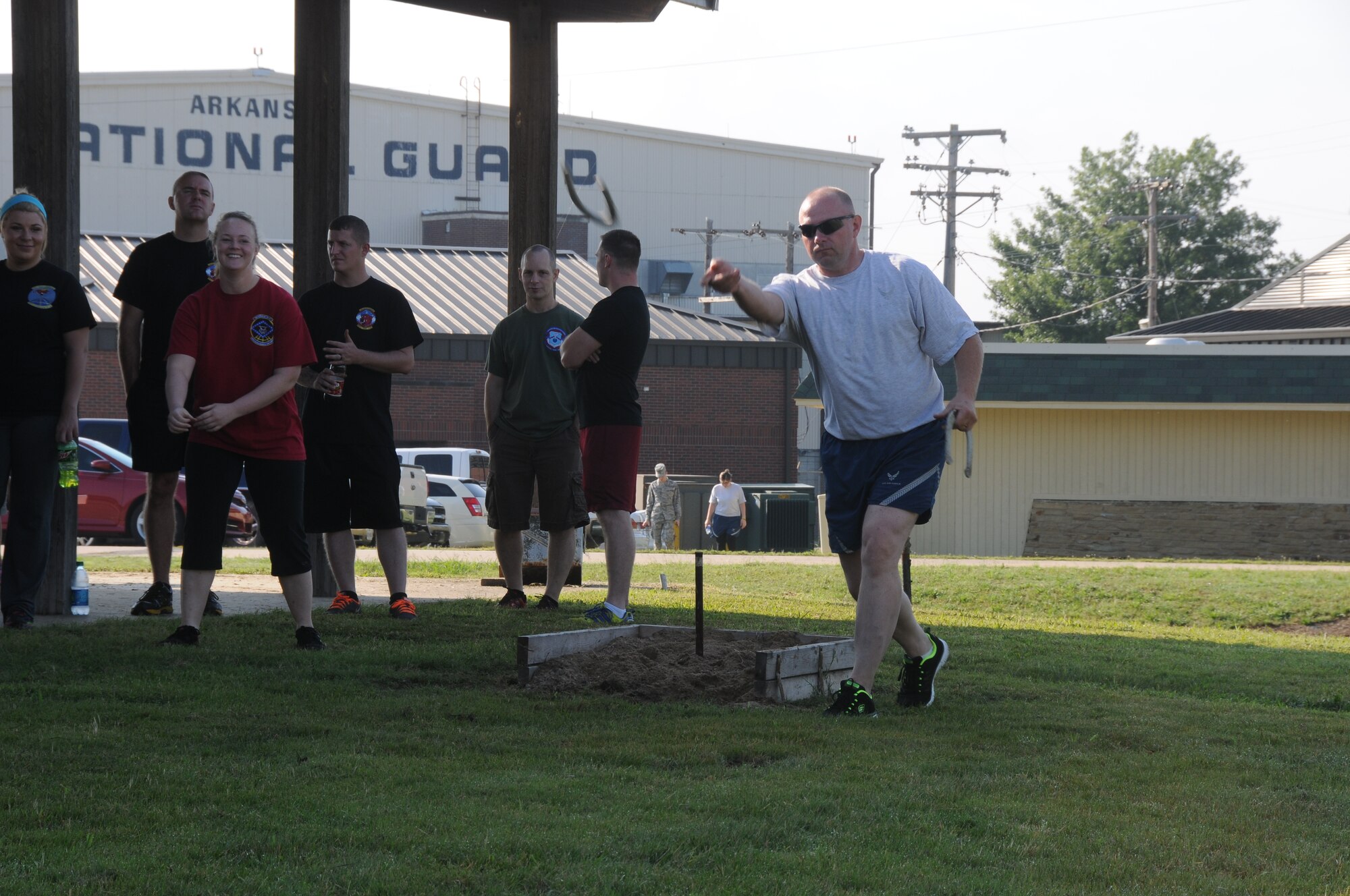 Airmen from the 188th Wing participate in a game of horseshoes during Wingman Day at the 188th Wing’s Ebbing Air National Guard Base Fort Smith, Arkansas, on Aug. 2, 2014. Events included volleyball, a free throw contest, a 1.5-mile run, fishing pole casting contest, golf chipping contest, golf cart driving course, and multiple fitness stations competition. (U.S. Air National Guard photo by Airman 1st Class Cody Martin/released)