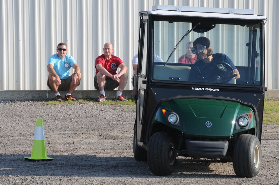 Lt. Col. Tina Lipscomb, 123rd Intelligence Squadron commander, navigates the golf cart driving course during Wingman Day at the 188th Wing’s Ebbing Air National Guard Base, Fort Smith, Arkansas, on Aug. 2, 2014. (U.S. Air National Guard photo by Airman 1st Class Cody Martin/released)