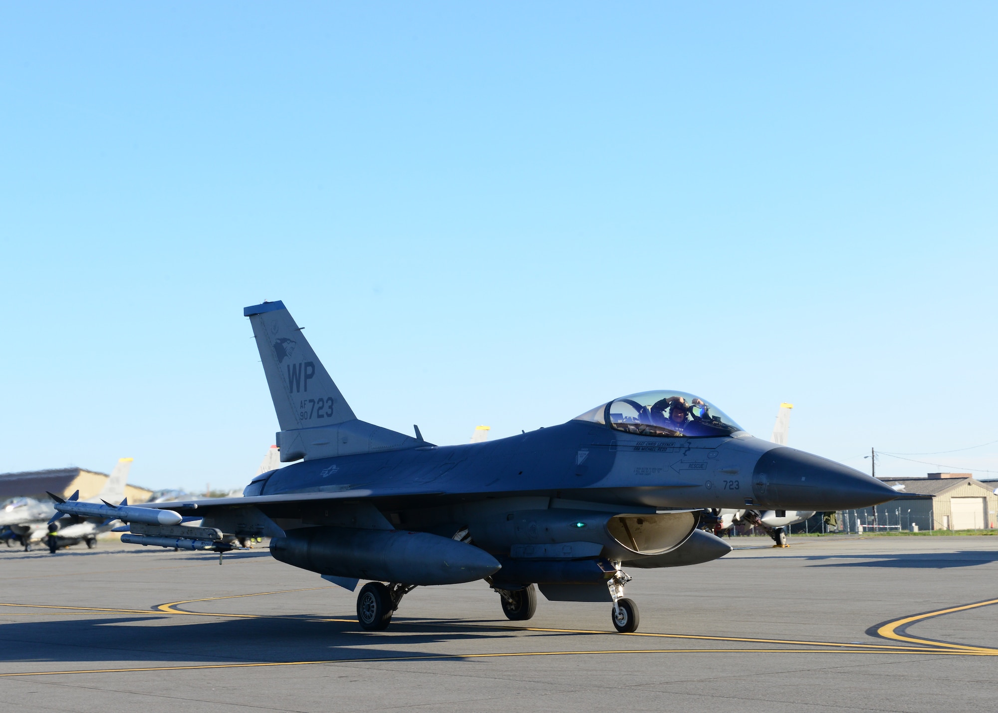 U.S. Air Force Capt. Sean Foote, 80th Fighter Squadron pilot assigned to Kunsan Air Base, South Korea, flashes the signature Wolf Pack “Crush Um” gesture before take off during RED FLAG-Alaska 14-3 Aug. 22, 2014, Eielson Air Force Base, Alaska. Conducting RED FLAG training in Alaska allows Wolf Pack Airmen to exchange tactics, techniques and procedures while improving interoperability with other flying units. (U.S. Air Force photo by Senior Airman Ashley Nicole Taylor/Released)