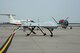 An MQ-1 Predator sits still after being moved into position on the flightline at Grand Forks Air Force Base, N.D., on Aug. 20, 2014. The Predator operated by the Happy Hooligans from the 119th Wing, Detachment 1 at Grand Forks AFB, was one of multiple unmanned aerial vehicles used during the first ever Unmanned Aircraft Systems Airspace Integration Test in the U.S. Aug. 4-22, 2014, at Grand Forks AFB. (U.S. Air Force photo/Senior Master Sgt. David Lipp)
