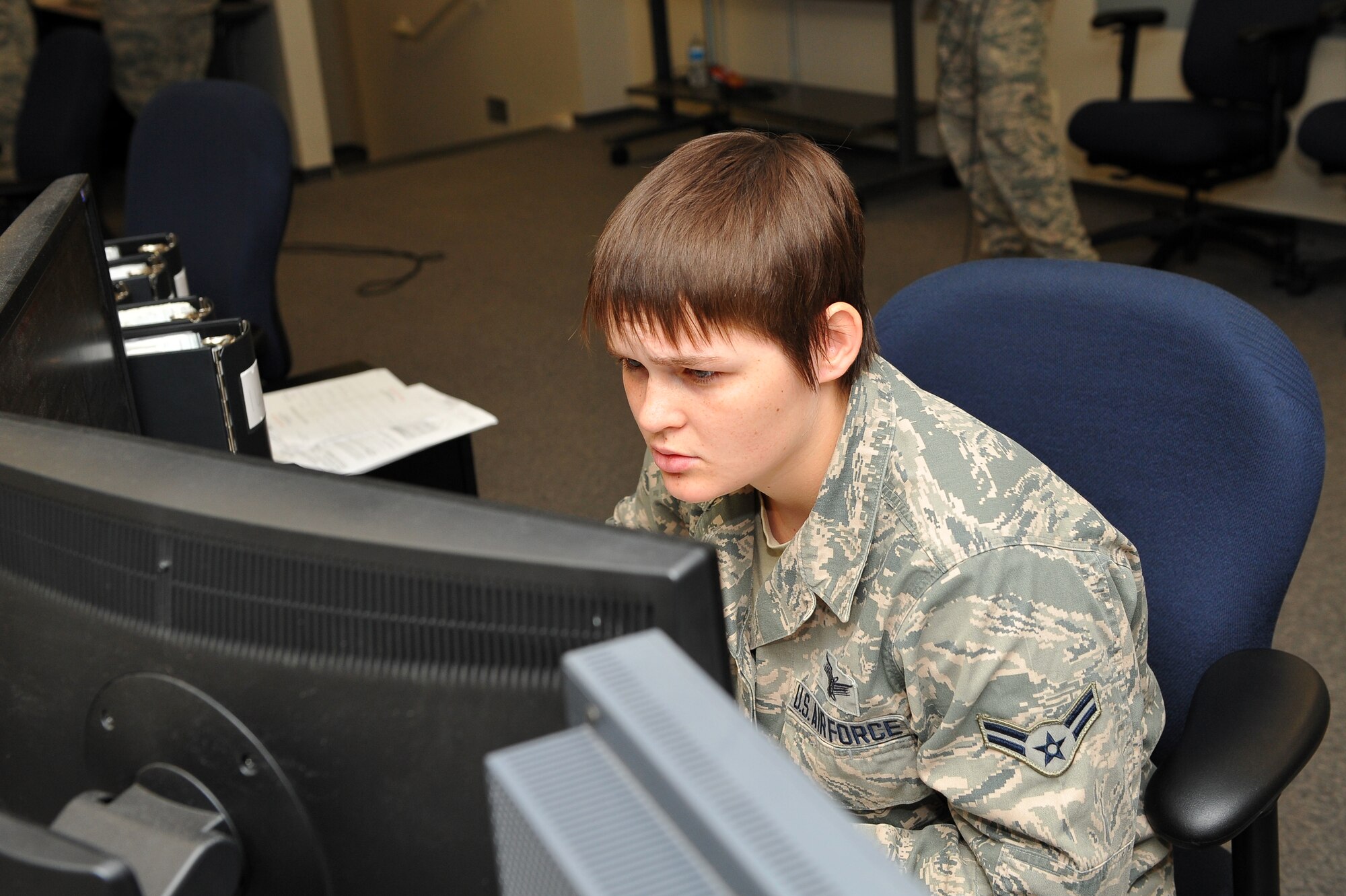 Airman 1st Class Shannon Henry, 2nd Space Warning Squadron, works on the systems side of the 460th Operation Support Squadron training simulator during the 460th Operations Group Panther Challenge Aug. 7, 2014, on Buckley Air Force Base, Colo. The challenge, held Aug. 4-13, was developed to provide members of Team Buckley an opportunity to improve their skills and expand their job knowledge in a competitive setting. Participants in the challenge included the 2nd and 8th Space Warning Squadrons, 460th Security Forces Squadron, and 460th Medical Group. (U.S. Air Force photo by Senior Airman Phillip Houk/Released)