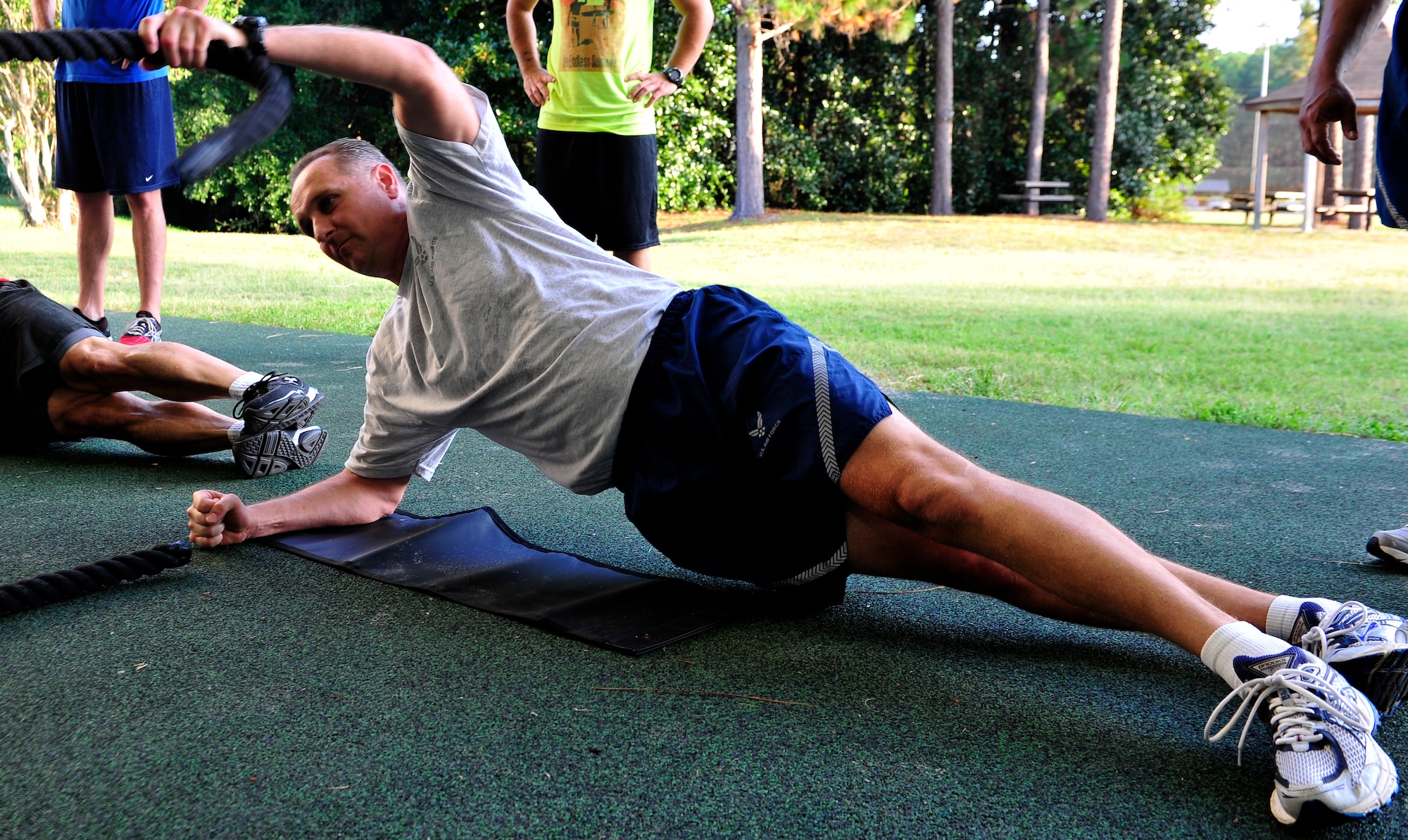 Chief Master Sgt. Sean Medsker, 1st Special Operations Group Chief, uses a battle rope during a core exercise at the Aderholt Fitness Center, Hurlburt Field, Fla., Aug. 22, 2014. Fitness instructors taught Airmen to use functional movements to maximize their strength. (U.S. Air Force photo/Staff Sgt. Tyler Placie)