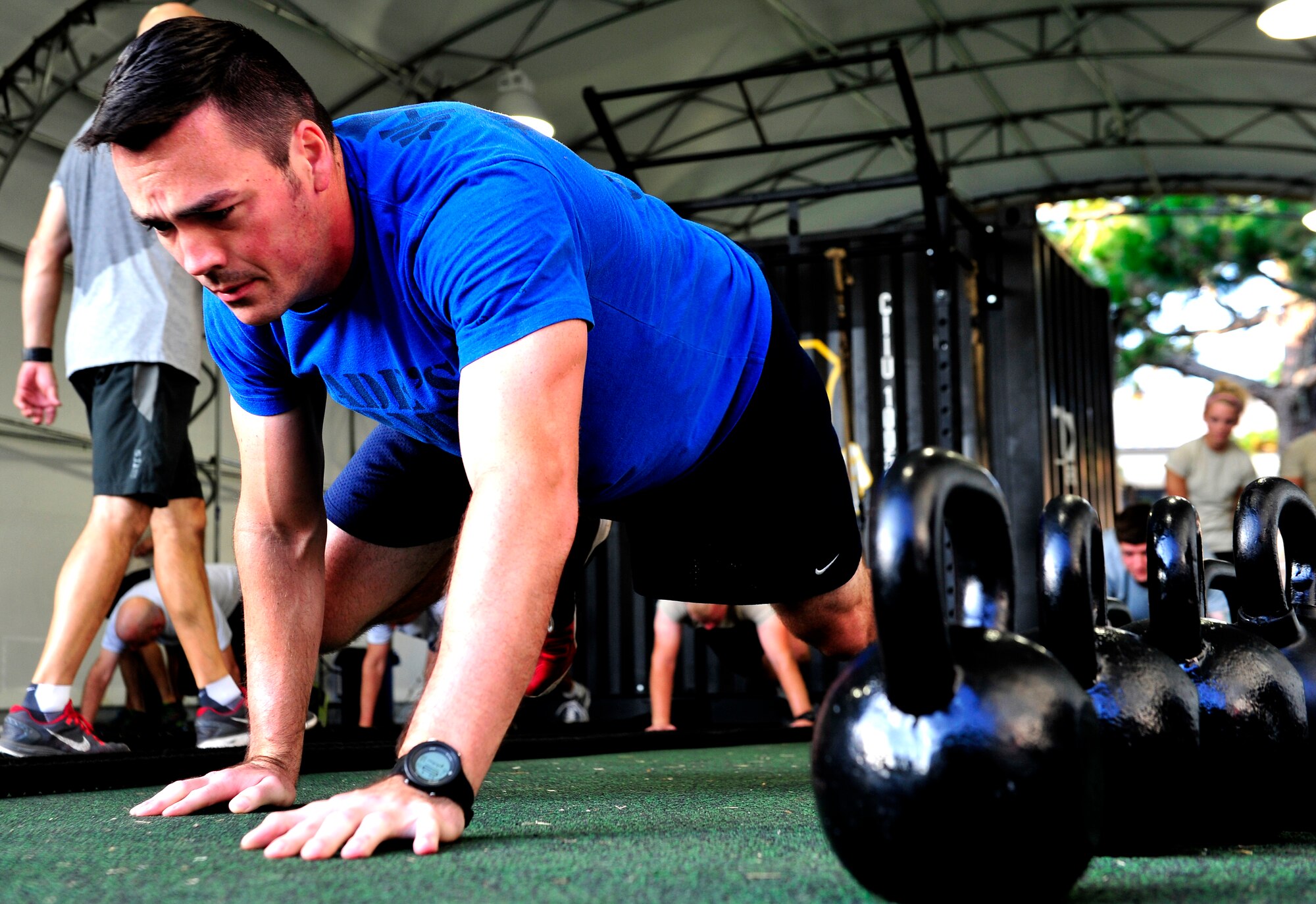 Tech. Sgt. Michael Dylan, 18th Flight Test Squadron, warms up for a functional fitness class at the Aderholt Fitness Center, Hurlburt Field, Fla., Aug. 22, 2014. Fitness instructors taught Airmen to use functional movements to maximize their strength. (U.S. Air Force photo/Staff Sgt. Tyler Placie)