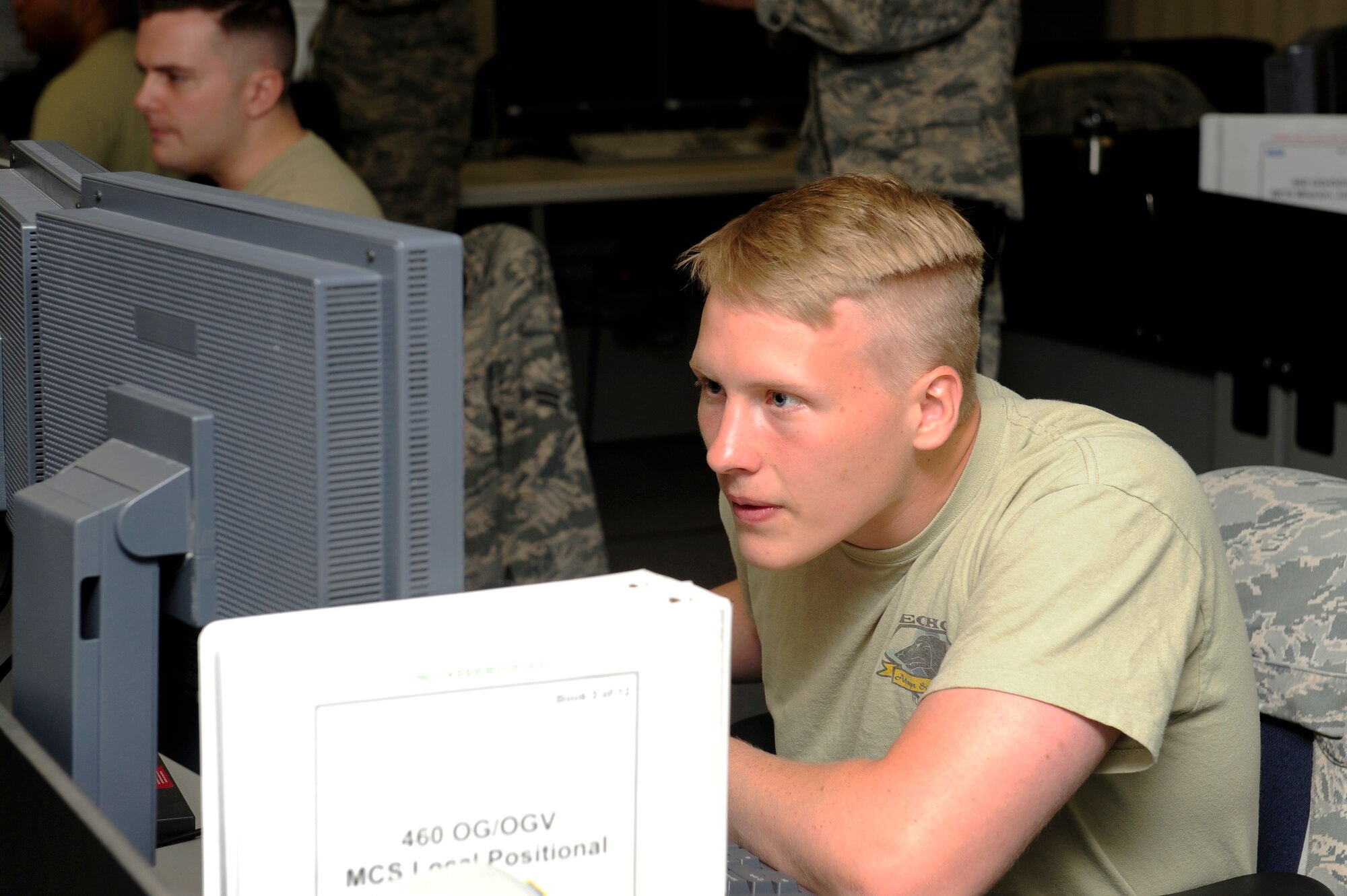 An Airman focuses on a task during the 460th Operations Group Panther Challenge Aug. 5, 2014, on Buckley Air Force Base, Colo. The challenge, held Aug. 4-13, was developed to provide members of Team Buckley an opportunity to improve their skills and expand their job knowledge in a competitive setting. Participants in the challenge included the 2nd and 8th Space Warning Squadrons, 460th Security Forces Squadron, and 460th Medical Group. (U.S. Air Force photo by Airman 1st Class Samantha Saulsbury/Released)
