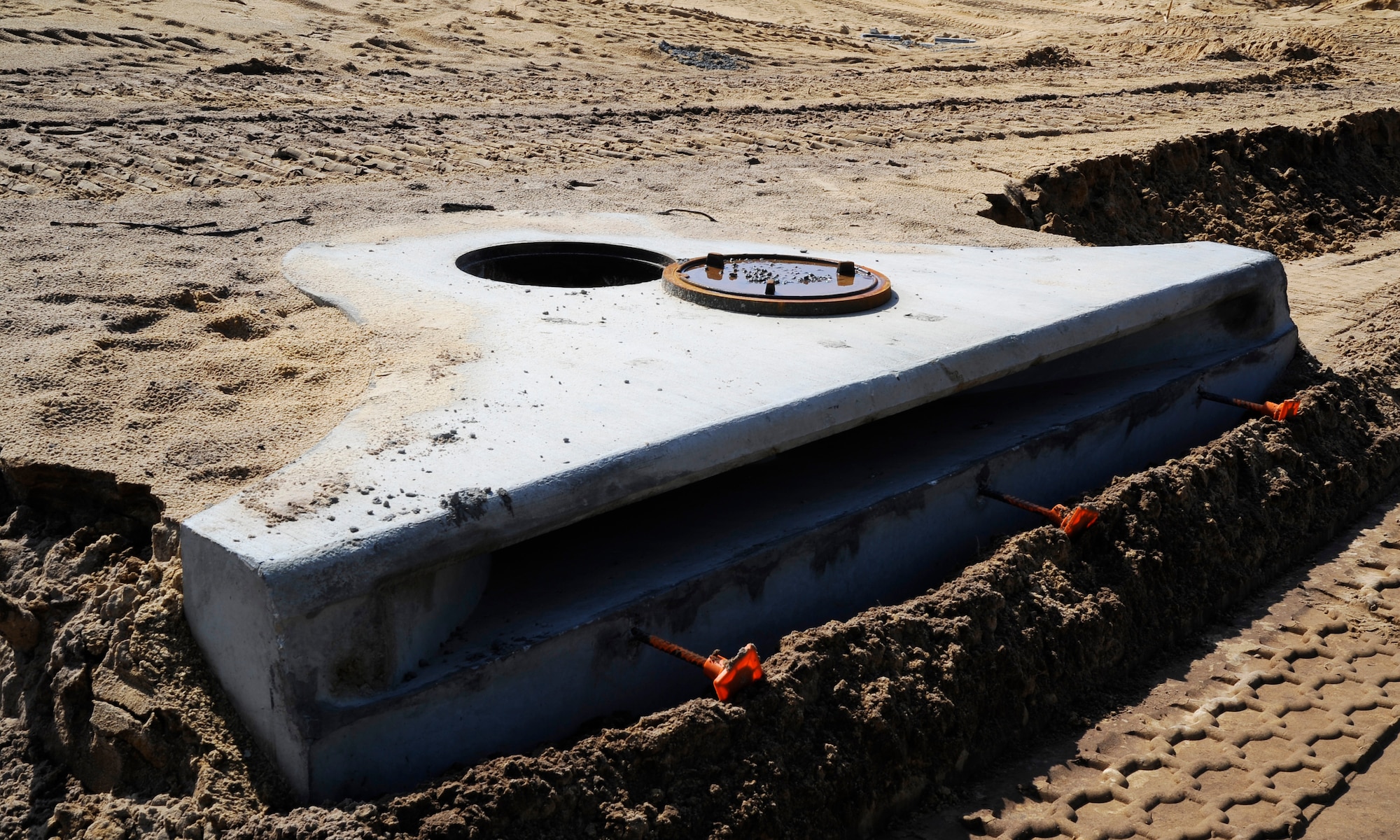 Sewer drainage and underground utilities are near completion at the Osprey Landing neighborhood construction site at Hurlburt Field, Fla., Aug. 20, 2014. In the next 30 days, construction of roads and homes should commence. (U.S. Air Force photo by Staff Sgt. Sarah Hanson)