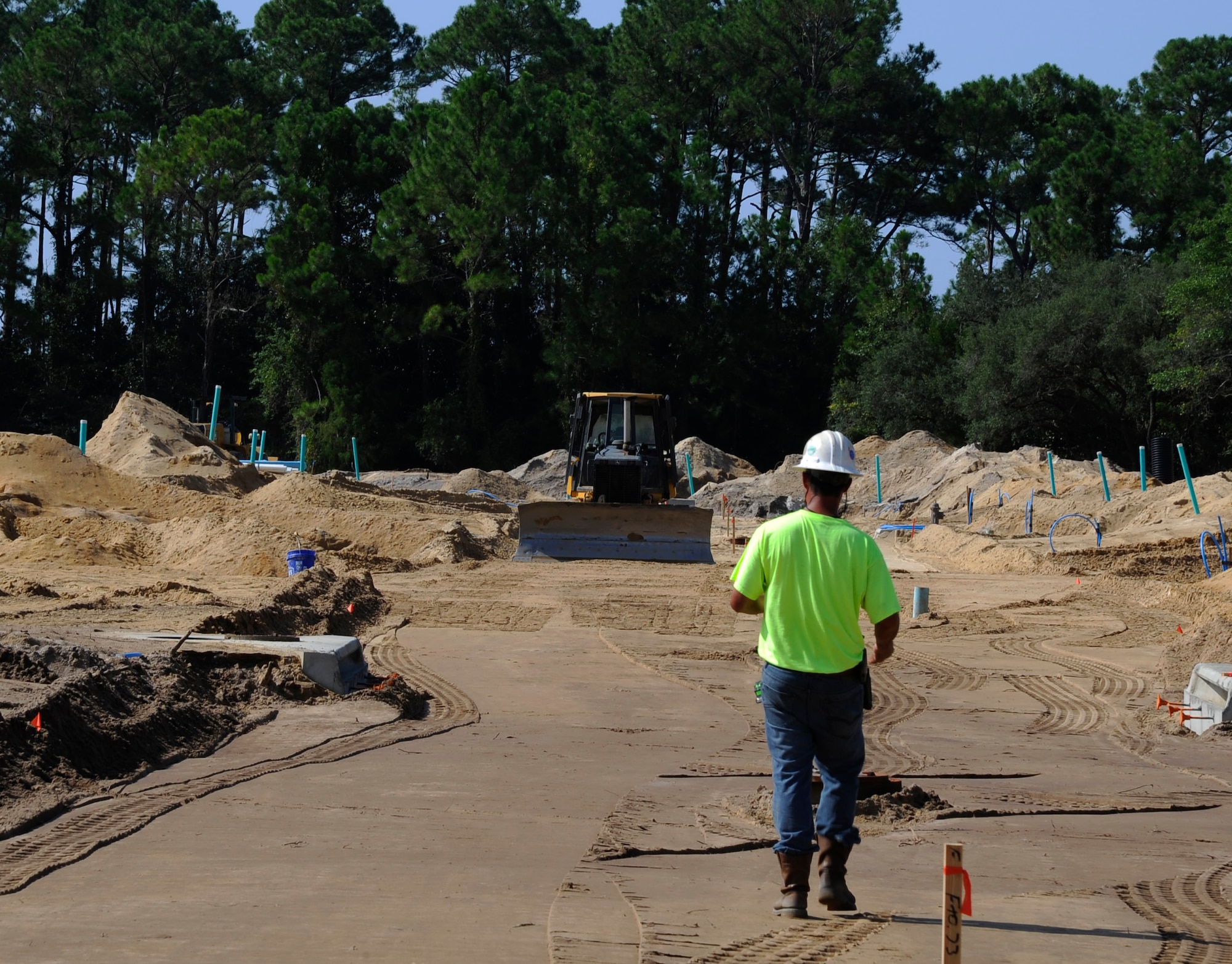 A worker walks the Osprey Landing neighborhood construction site at Hurlburt Field, Fla., Aug. 20, 2014. Base officials, in conjunction with Corvias Military Living, held a ground-breaking ceremony June 3. (U.S. Air Force photo by Staff Sgt. Sarah Hanson)