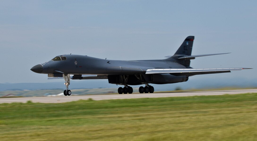 A B-1 bomber takes off during a stand-off weapons integration training exercise at Ellsworth Air Force Base, S.D., Aug. 13, 2014. The week-long training consisted of B-1s from the 34th Bomb Squadron and several B-52 Stratofortress bombers assigned to the 23rd Bomb Squadron, Minot Air Force Base, N.D., conducting simulated combat scenarios at the Powder River airspace to help prepare for real-world contingencies. (U.S. Air Force photo by Senior Airman Zachary Hada/Released)
