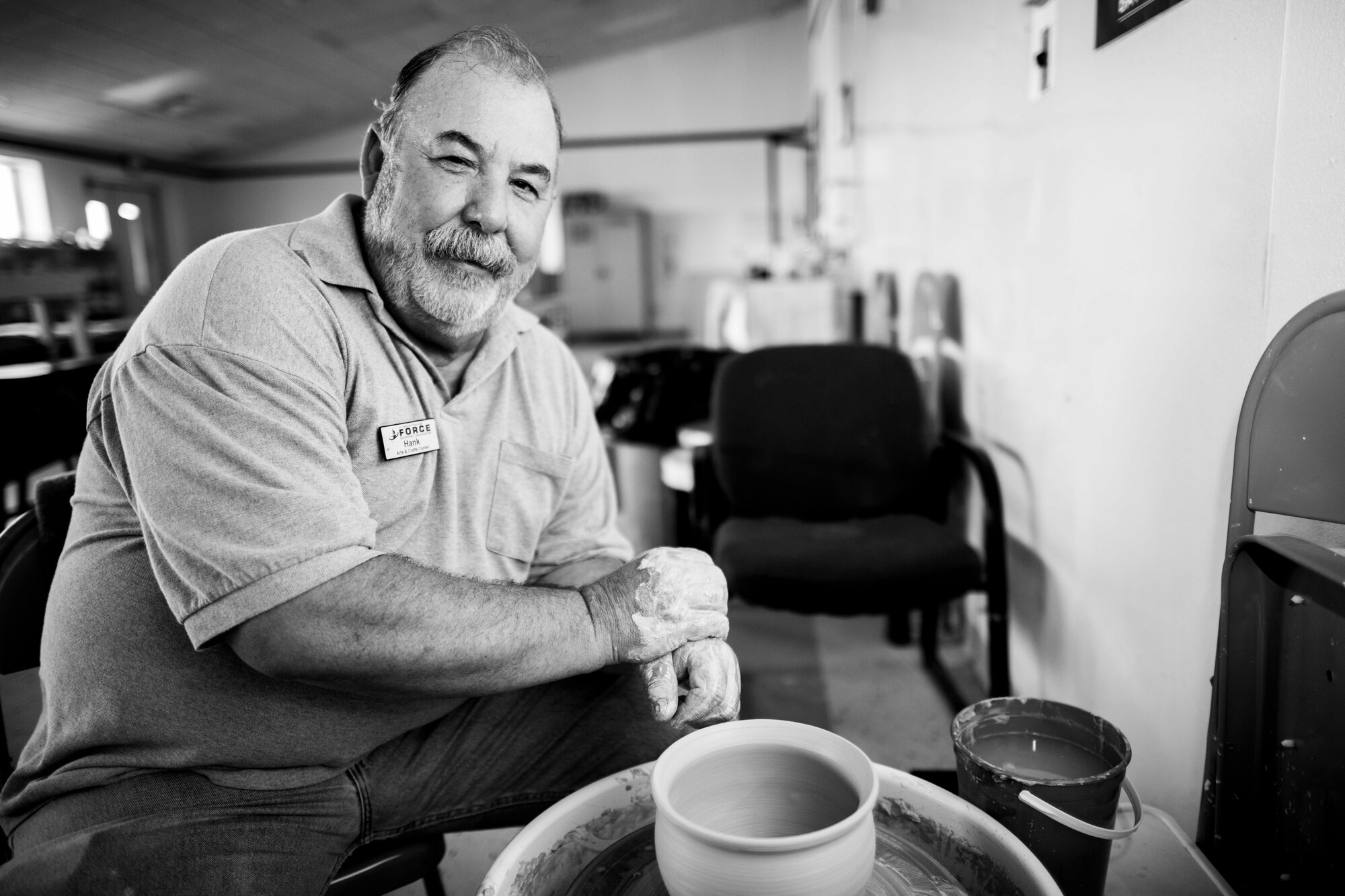 Hank Hangsleben, Arts and Crafts Center recreation assistant, sits at the pottery wheel at Holloman Air Force Base, N.M., Aug 22. The Arts and Crafts Center offers pottery classes by appointment Monday through Friday during normal business hours of 10 a.m. to 5 p.m. Hangsleben, an expert potter, studied under the tutelage of world-renowned artists in Japan and Hawaii and uses state of the art pottery equipment to instruct his students. 