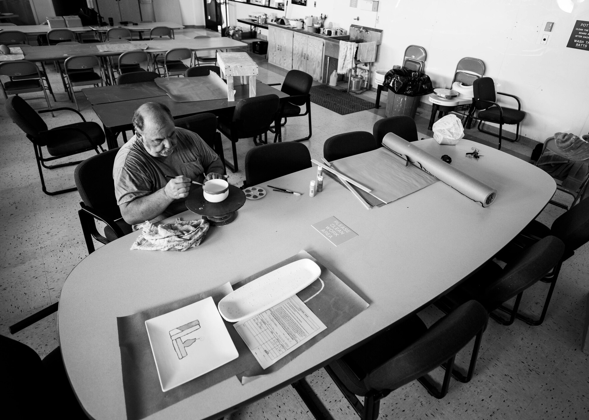 Hank Hangsleben, Arts and Crafts Center recreation assistant, paints a dried piece before putting it into the kiln at Holloman Air Force Base, N.M., Aug 22. The Arts and Crafts Center offers pottery classes by appointment Monday through Friday during normal business hours of 10 a.m. to 5 p.m. Hangsleben, an expert potter, studied under the tutelage of world-renowned artists in Japan and Hawaii and uses state of the art pottery equipment to instruct his students. 