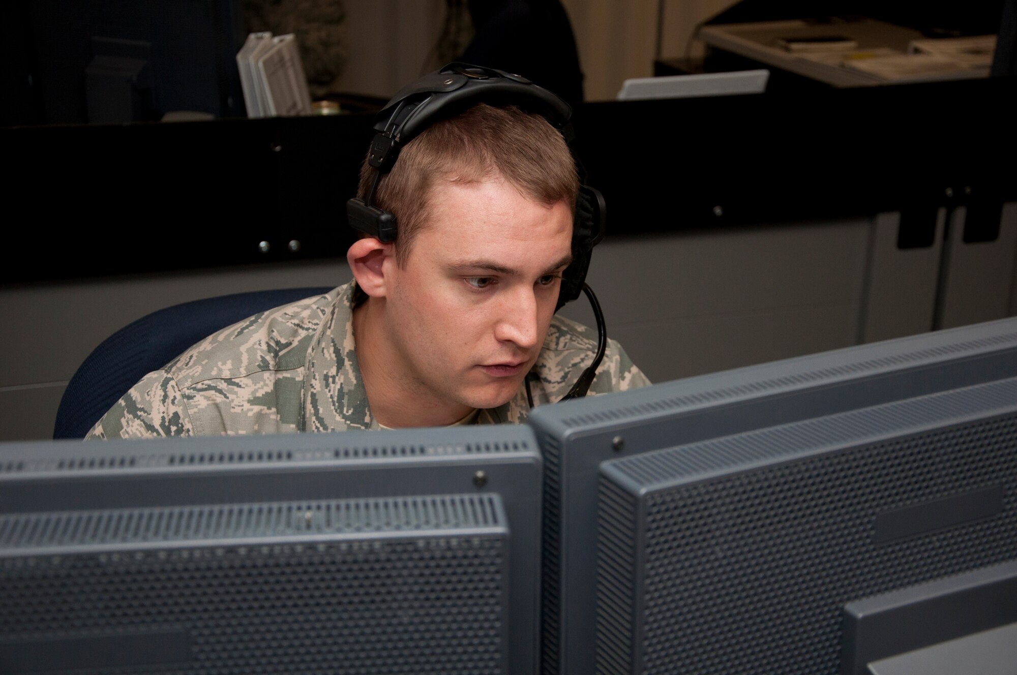 Staff Sgt. Andrew Williams, 8th Space Warning Squadron, focuses on a task during the 460th Operations Group Panther Challenge Aug. 4, 2014, on Buckley Air Force Base, Colo. The challenge, held Aug. 4-13, was developed to provide members of Team Buckley an opportunity to improve their skills and expand their job knowledge in a competitive setting. Participants in the challenge included the 2nd and 8th Space Warning Squadrons, 460th Security Forces Squadron, and 460th Medical Group. (U.S. Air Force photo by Tech. Sgt. Kali L. Gradishar/Released)