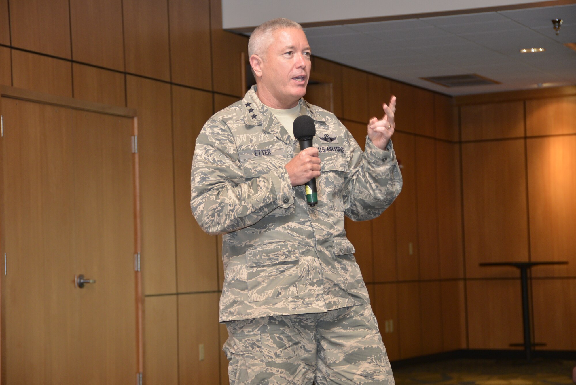 Lt. Gen. William Etter, Commander, Continental U.S. Aerospace Defense Region-1 st Air Force (Air Forces Northern), makes a point during his commander's call Aug. 20. During the event, the general and some of his staff members addressed concerns of AFNORTH members to include budget, manpower and changes to the enlisted evaluation system. (Photo by Mary McHale)