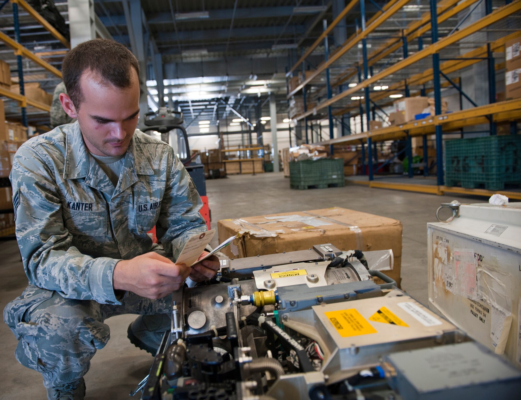 Senior Airman Andrew Kanter, 1st Special Operations Logistic Readiness Squadron supply journeyman, checks a packaging label on a radar transmitter at Hurlburt Field, Fla., Aug. 22, 2014. Verifying label information is important to ensure that products are sent to the correct places. (U.S. Air Force photo/Senior Airman Krystal M. Garrett)   