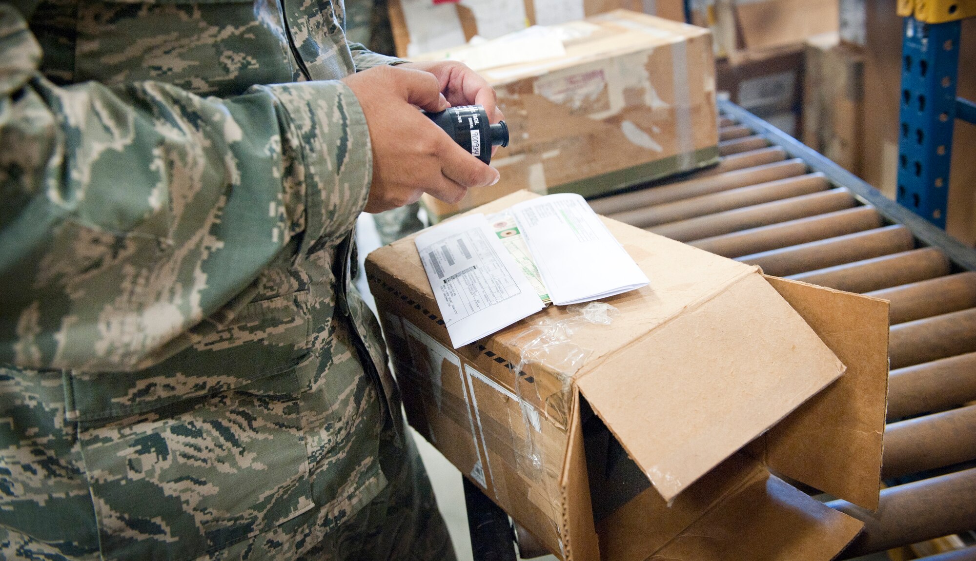 Senior Airman Matthew Stilwell, 1st Special Operations Logistic Readiness Squadron supply journeyman, checks information on an unserviceable equipment label at Hurlburt Field, Fla., Aug. 22, 2014. Verifying label information is important to ensure that products are sent to the correct places. (U.S. Air Force photo/Senior Airman Krystal M. Garrett)     