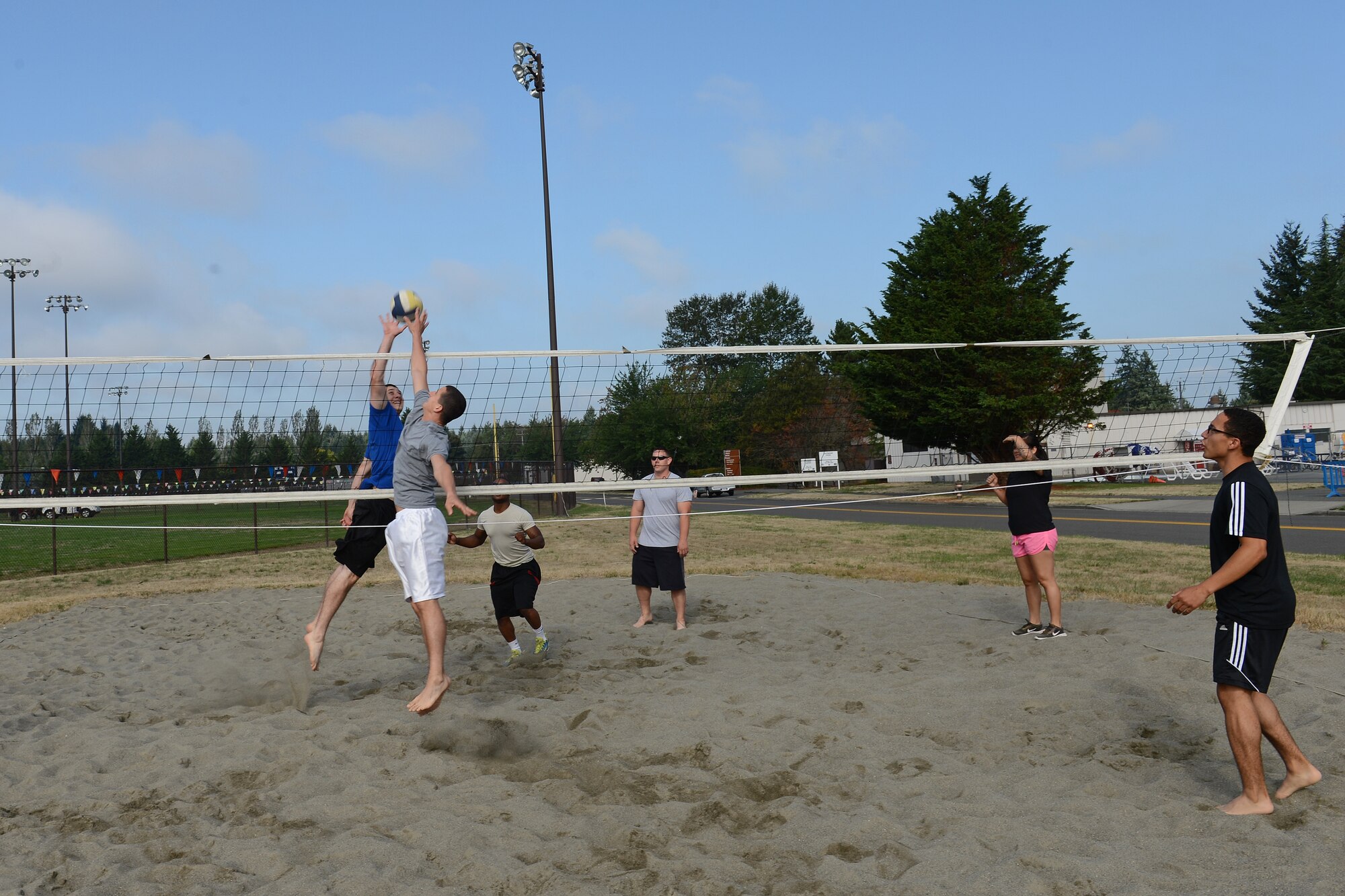 Airmen from the 627th Logistics Readiness Squadron warm-up prior to a game of volleyball during Sports Day Aug. 22, 2014, at Joint Base Lewis-McChord, Wash. This year’s events included volleyball, dodgeball, ultimate Frisbee, Nerf gun challenges, and kickball. (U.S. Air Force photo/Airman 1st Class Jacob Jimenez)