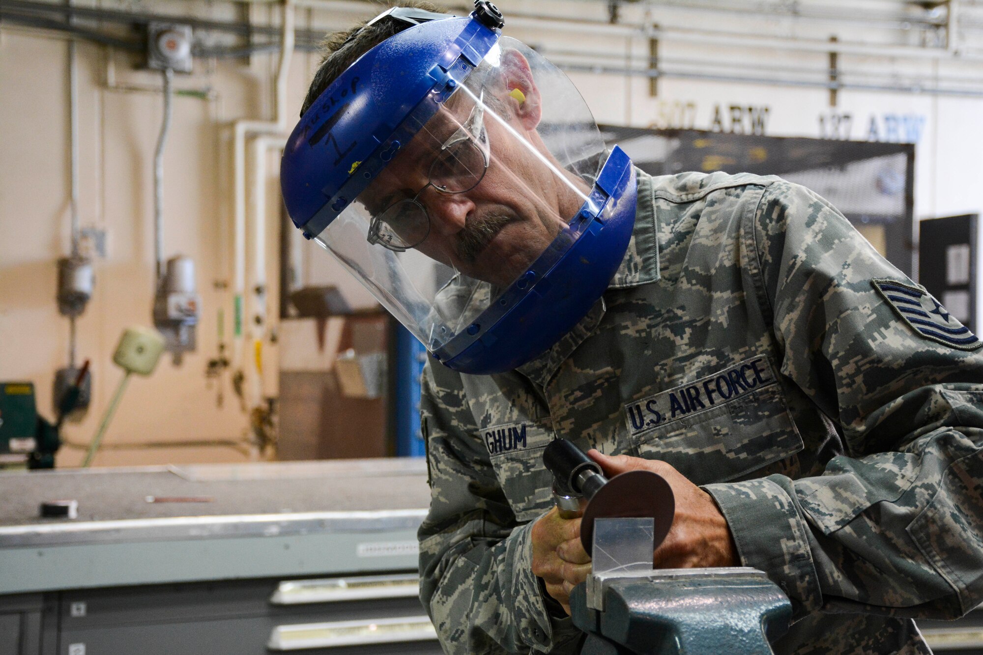 Technical Sergeant Harold Fulghum shapes and grinds a joggle block to be used on the simulated aircraft structure being built by the 507th Air Refueling Wing fabrication flight's sheet metal shop.  Fulghum came up with the idea to build the simulator.  It gives sheet metal workers the opportunity to work on the leading edge of a KC-135R Stratotanker wing without the jet actually being broken.  (U.S. Air Force photo/Senior Airman Mark Hybers)
