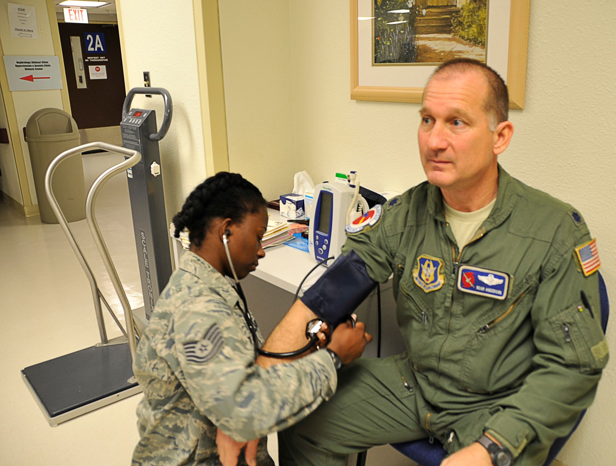 Lt. Col. Bear Anderson, 53rd Weather Reconnaissance Squadron, has his blood pressure checked by a medical practicioner with the 403rd Aeromedical Staging Squadron