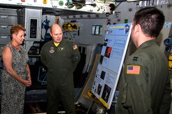 Lt. Col. David Kern, 317th Airlift Squadron pilot, briefs the Honorable Jessica L. Garfola Wright, Under Secretary of Defense for Personnel and Readiness, about the integrated Active Duty and Reserve program from the inside of a C-17 Globemaster III aircraft at Joint Base Charleston, S.C. Aug. 22, 2014. Wright is the senior policy advisor to the secretary of defense on recruitment, career development, pay and benefits for 1.4 million Active-Duty military servicemembers, 1.1 million Guard and Reserve servicemembers, 740,000 Department of Defense civilians, and is responsible for overseeing the overall state of military readiness. (U.S. Air Force photo/Staff Sgt. Rashard Coaxum)