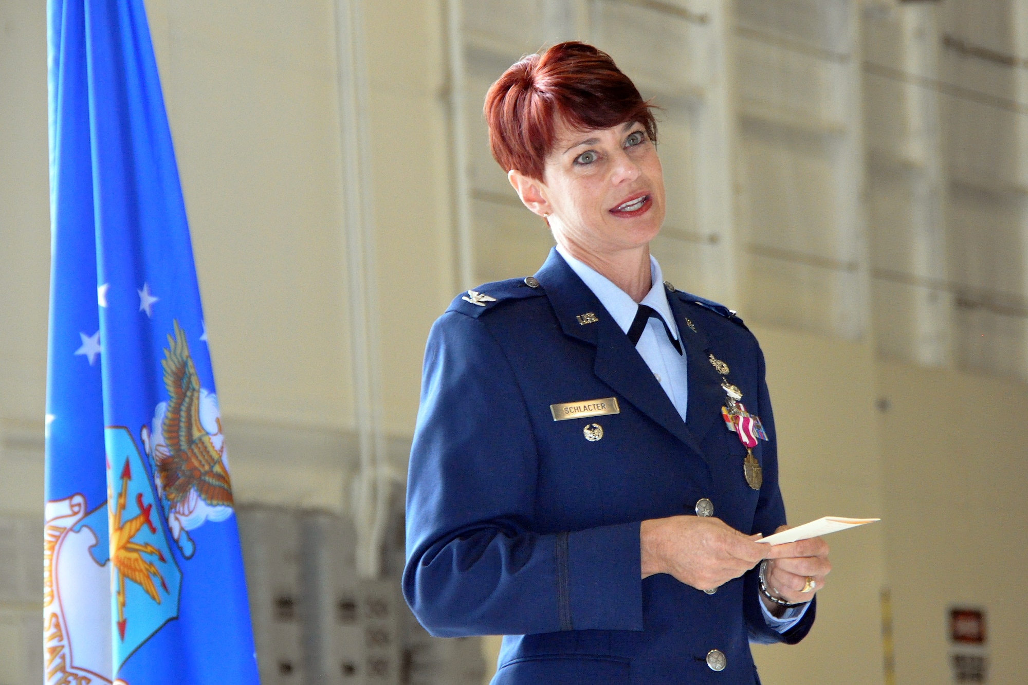 Col. Christine Schlacter, IMA to the Director, Operational Capability Requirements, Pentagon, addresses the audience at her promotion ceremony held at Seymour Johnson Air Force Base, Aug. 2014. Schlacter is formerly the 916th Maintenance Group deputy commander. (U.S. Air Force photo by Master Sgt. Wendy Lopedote)