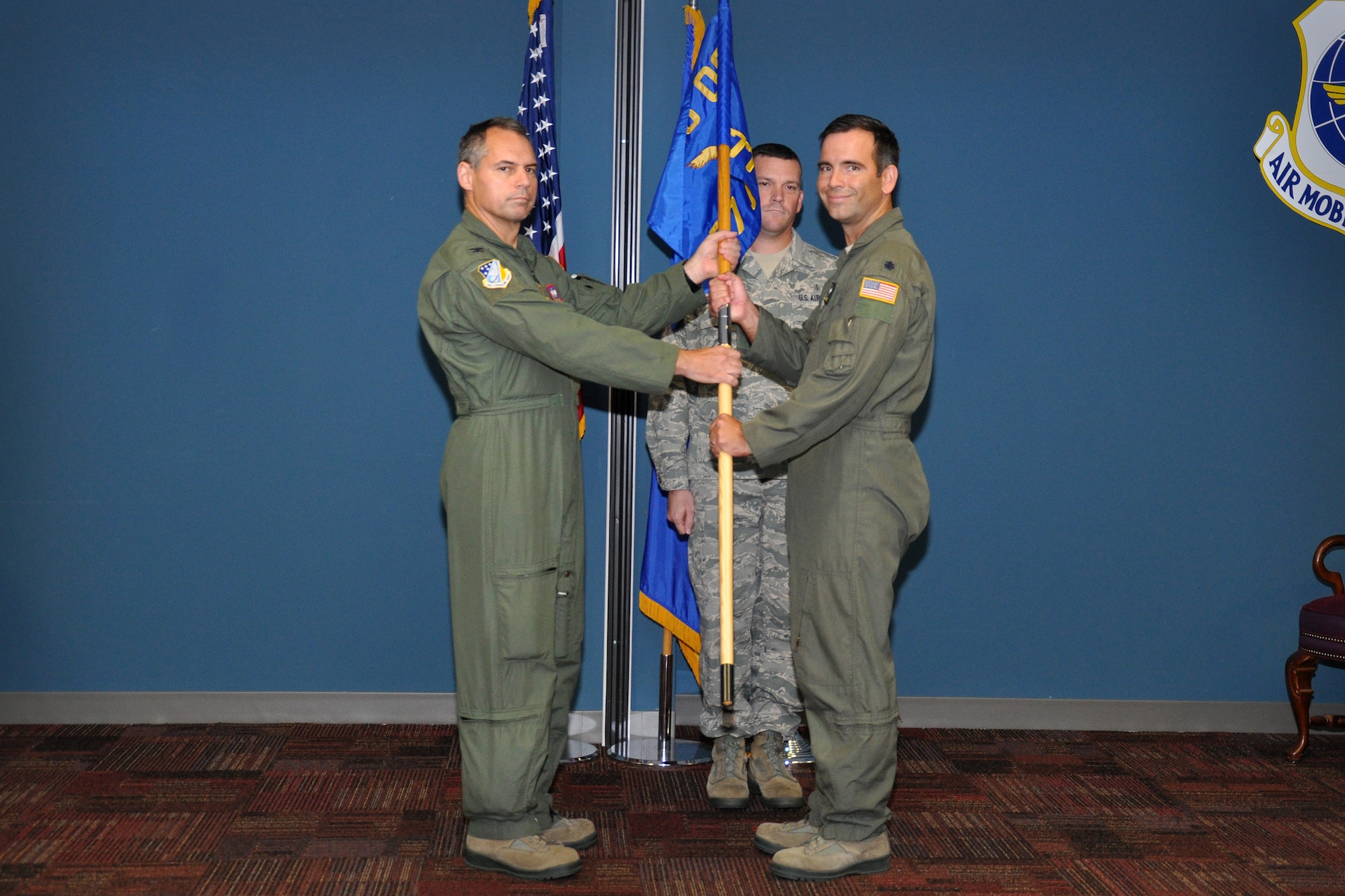 Lt. Col. Gregory Lassere, receives command of the 77th Air Refueling Squadron from Col. Anthony Polashek, 916th Operations Group commander at the 77th ARS Assumption of Command ceremony, Aug. 2014. (U.S. Air Force photo by Staff Sgt. Alan Abernethy)