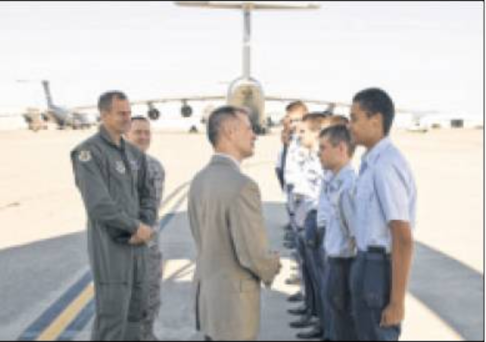 Kevin Geiss, director, Human Effectiveness Directorate, 711th Human Performance Wing, Air Force Research Laboratory, greets Civil Air Patrol cadets during an official Air Force visit to Travis AFB, Calif. (Air Force photo by Travis Public Affairs)