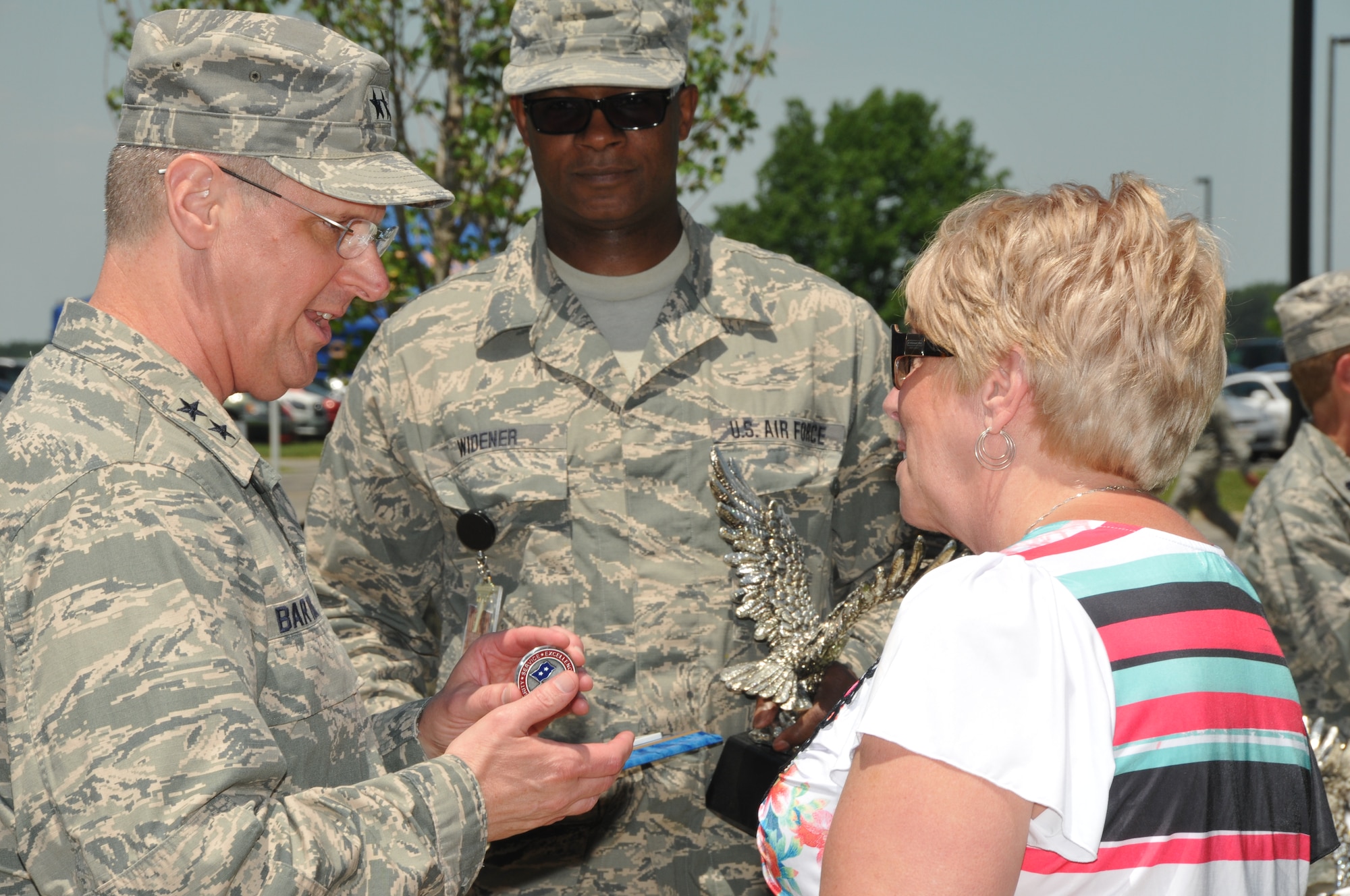 Major General Mark Bartman, Assistant Adjutant General-Air, Ohio National Guard, visits during the Color Fun 5k at the 179th Airlift Wing, Mansfield, OH, June 7, 2014. Maj. Gen. Bartman helped in presenting awards to individuals for involvement in the Airman and Family Readiness Center prior to the start of the 5k run. Prior to the start of the 5k, SSgt Gabriel Almeda played the national anthem on an electric guitar. (U.S. Air National Guard Photo by TSgt Joseph Harwood \Released)