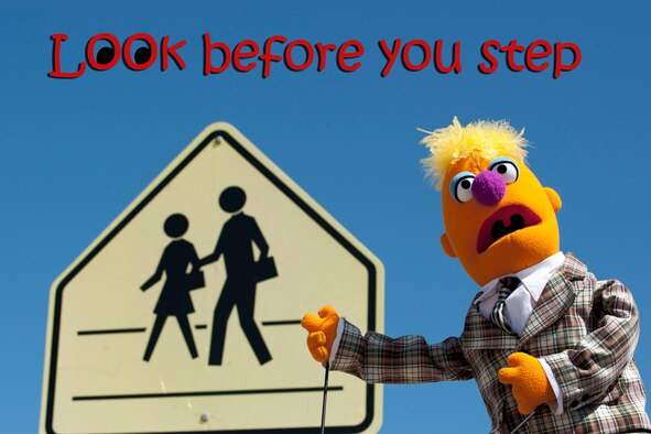 As summer vacation comes to an end for students, our puppet friend Dirk Donhopper reminds school children to look both ways before entering into school zone crosswalks.  Clark County schools reopen for the 2014-15 school year Aug. 25. Drivers are reminded to obey speed limits when in a school zones or school crossing zones, and to stop for pedestrians in crosswalks.  Nevada State Law establishes speed limits in School Zones in front of schools at 15 mph and School Crossing Zones, crossings to and from, but not directly in front of a school at 25 mph. The Las Vegas Metropolitan Police Department issued the following back-to-school safety reminder; stay alert at crosswalks, stop when school bus lights are flashing and remind drivers school-zone speeding fines start at $190.  Police officers from North Las Vegas, Las Vegas, Henderson and the Clark County School District will be enforcing traffic laws in school zones. (U.S. Air Force illustration by Lorenz Crespo) 
