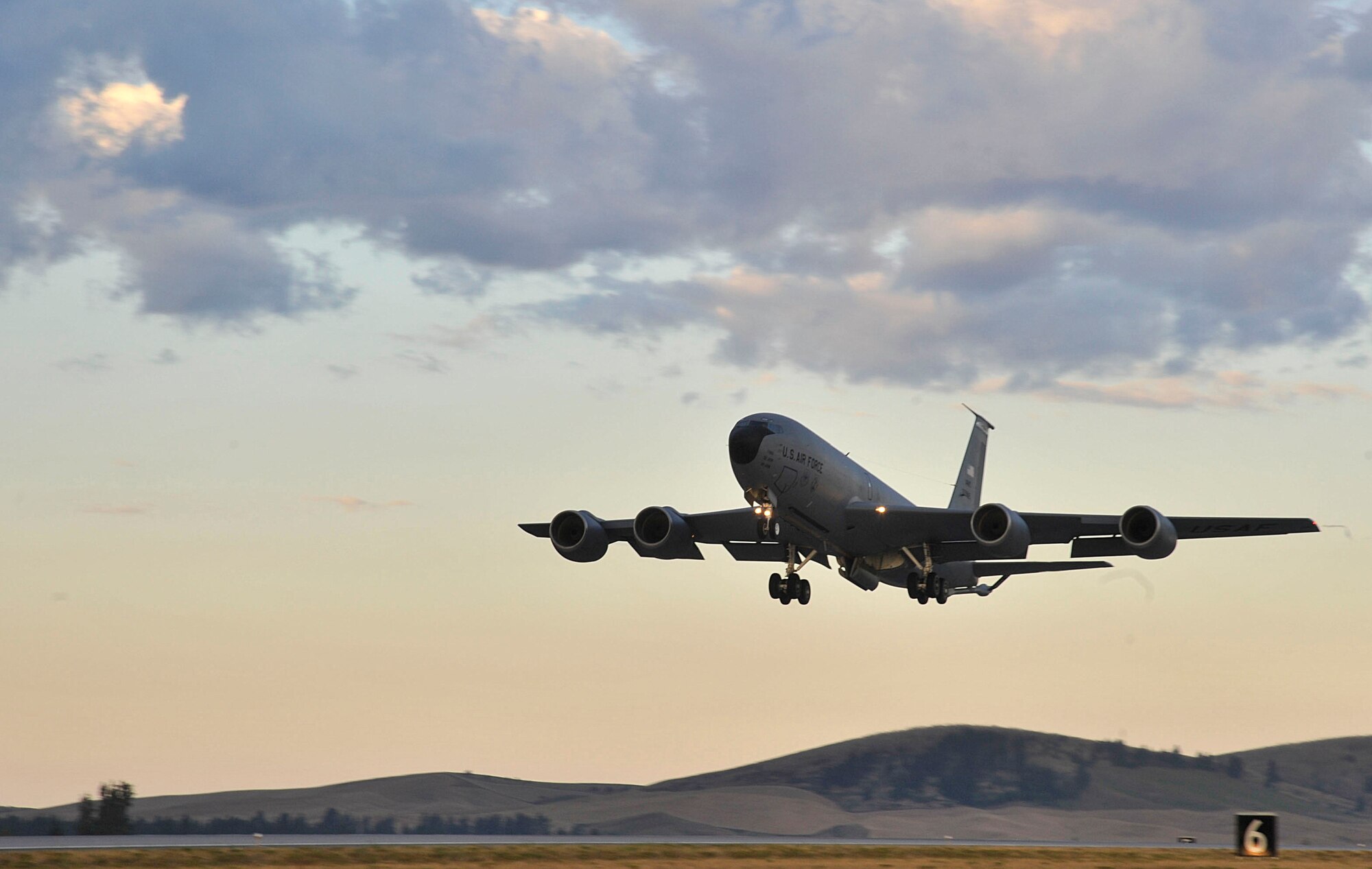 A KC-135 Stratotanker takes off during an operational readiness exercise at Fairchild Air Force Base, Washington, Aug. 22, 2014. Seven tankers were launched within minutes of each other at the conclusion of the Wing Inspection Team-planned exercise to ensure the base’s preparedness for various potential emergency scenarios, and to evaluate the base’s ability to accomplish the mission. (U.S. Air Force photo by Senior Airman Mary O’Dell/Released)