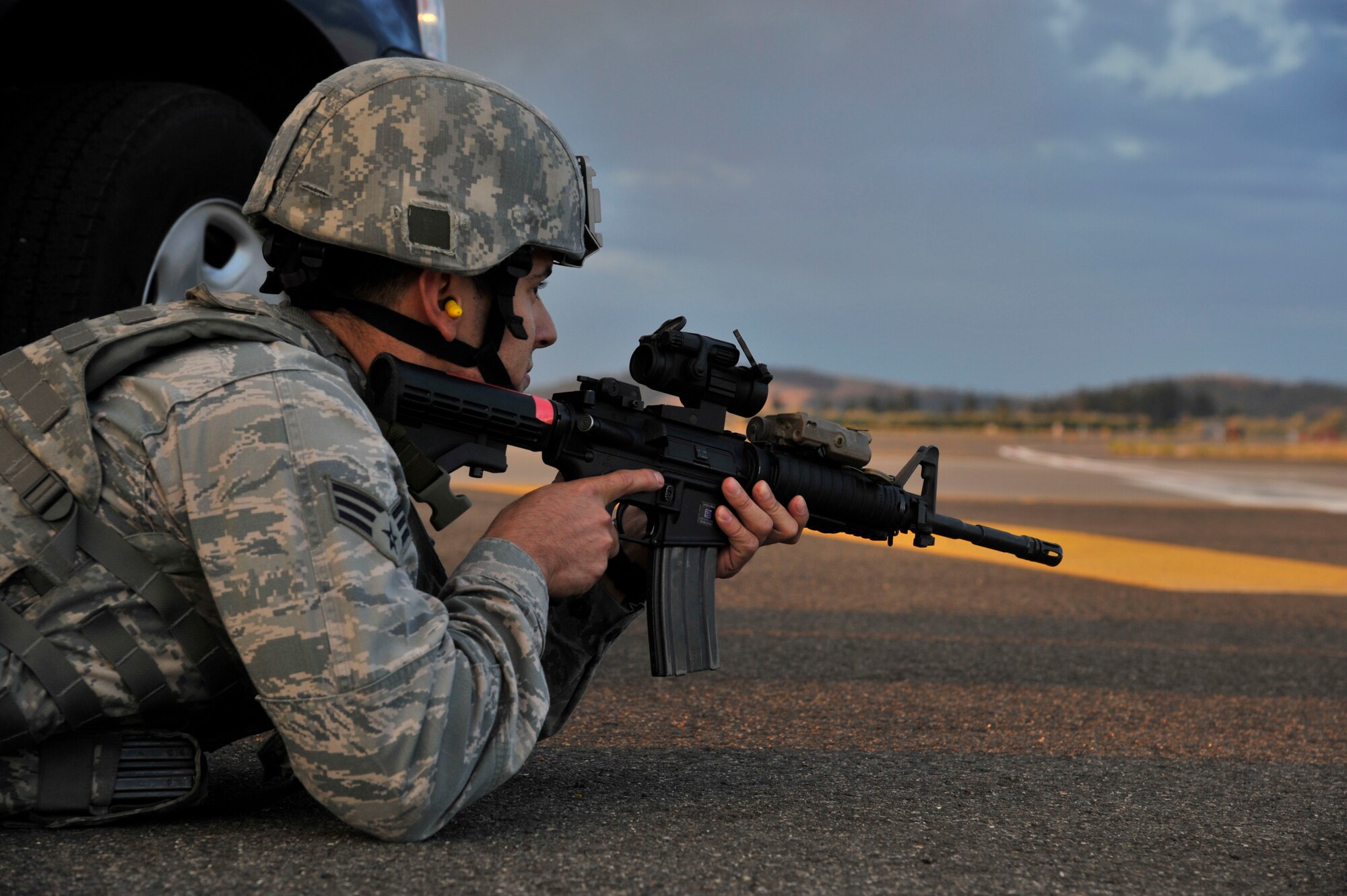 A 92nd Security Forces Squadron Airman protects the flight line ensuring safe and secure mission accomplishment during an operational readiness exercise at Fairchild Air Force Base, Washington, Aug. 22, 2014. Training exercises are planned and executed regularly to maintain mission readiness, to ensure the base’s preparedness for various potential emergency scenarios, and to evaluate the base’s ability to accomplish the mission. (U.S. Air Force photo by Senior Airman Mary O’Dell/Released)