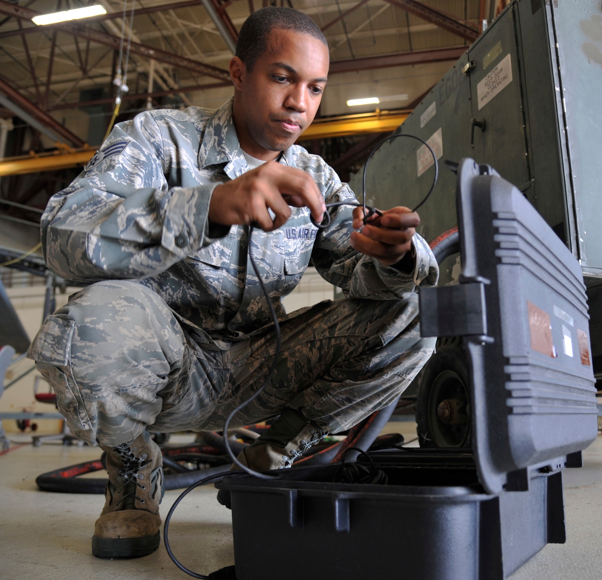 U.S. Air Force Senior Airman Christopher Papa, 509th Maintenance Squadron egress technician, sets communication headsets at Whiteman Air Force Base, Missouri, Aug. 12, 2014. The 509th Maintenance Squadron's egress shop maintain the B-2s' egress systems, ensuring they function properly for pilot safety. (U.S. Air Force photo by Airman 1st Class Keenan Berry/Released)