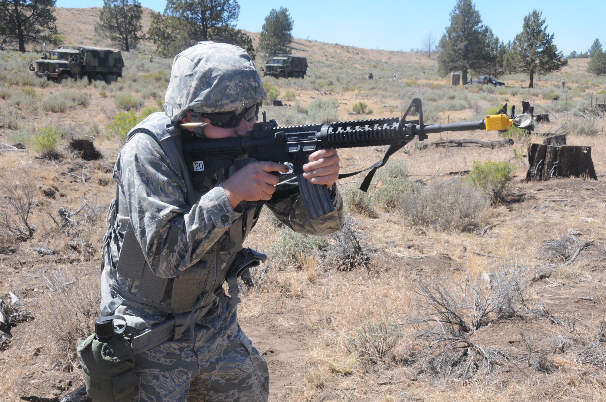 U.S. Air Force 1st Lt. Daniel Dierickx of the 270th Air Traffic Control Squadron fires blanks after completing an exercise to hone base defense skills near Bonanza, Oregon on public land, July 26, 2014. The 270th Air Traffic Control Squadron controls the airspace for the 173rd Fighter Wing as well as civilian aircraft at Kingsley Field but also has an expeditionary tasking. This year’s annual training emphasized that capability and involved several exercises off base. (U.S. Air National Guard photo by Tech. Sgt. Jefferson Thompson/Released)