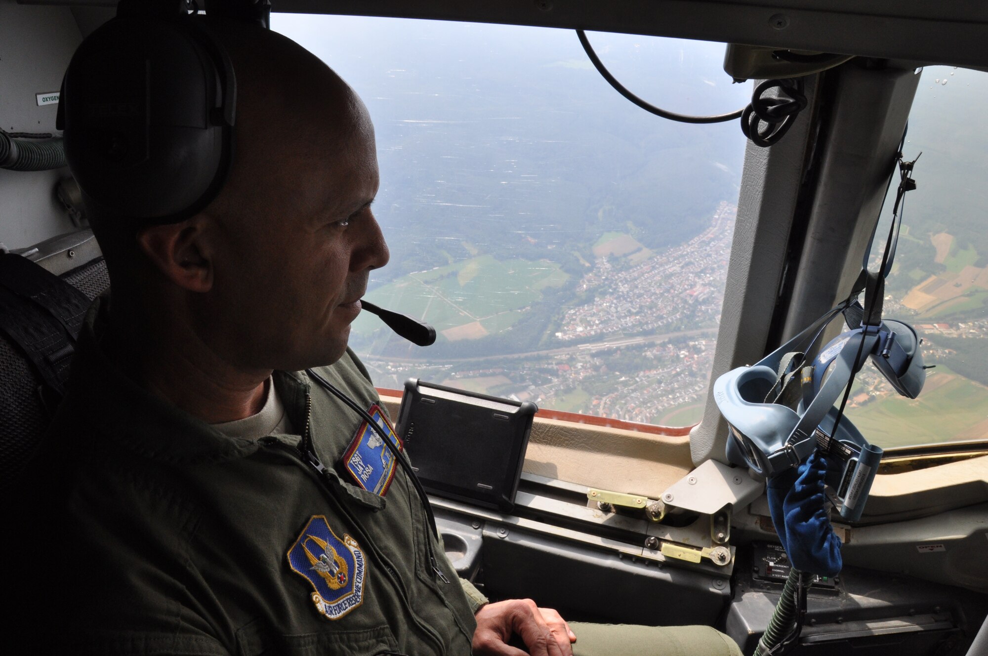 Tech Sgt. Anibal Rosa, 76th Air Refueling Squadron boom operator, takes in the scenic German landscape aboard a KC-10 aircraft traveling to Ramstein Air Base, Germany July 26. The flight was on a mission to deliver 14 cargo pallets, 67 Space A passengers, and return 25 88th Aerial Port Squadron member finishing annual tour training (U.S. Air Force photo/Senior Airman Chelsea Smith).  