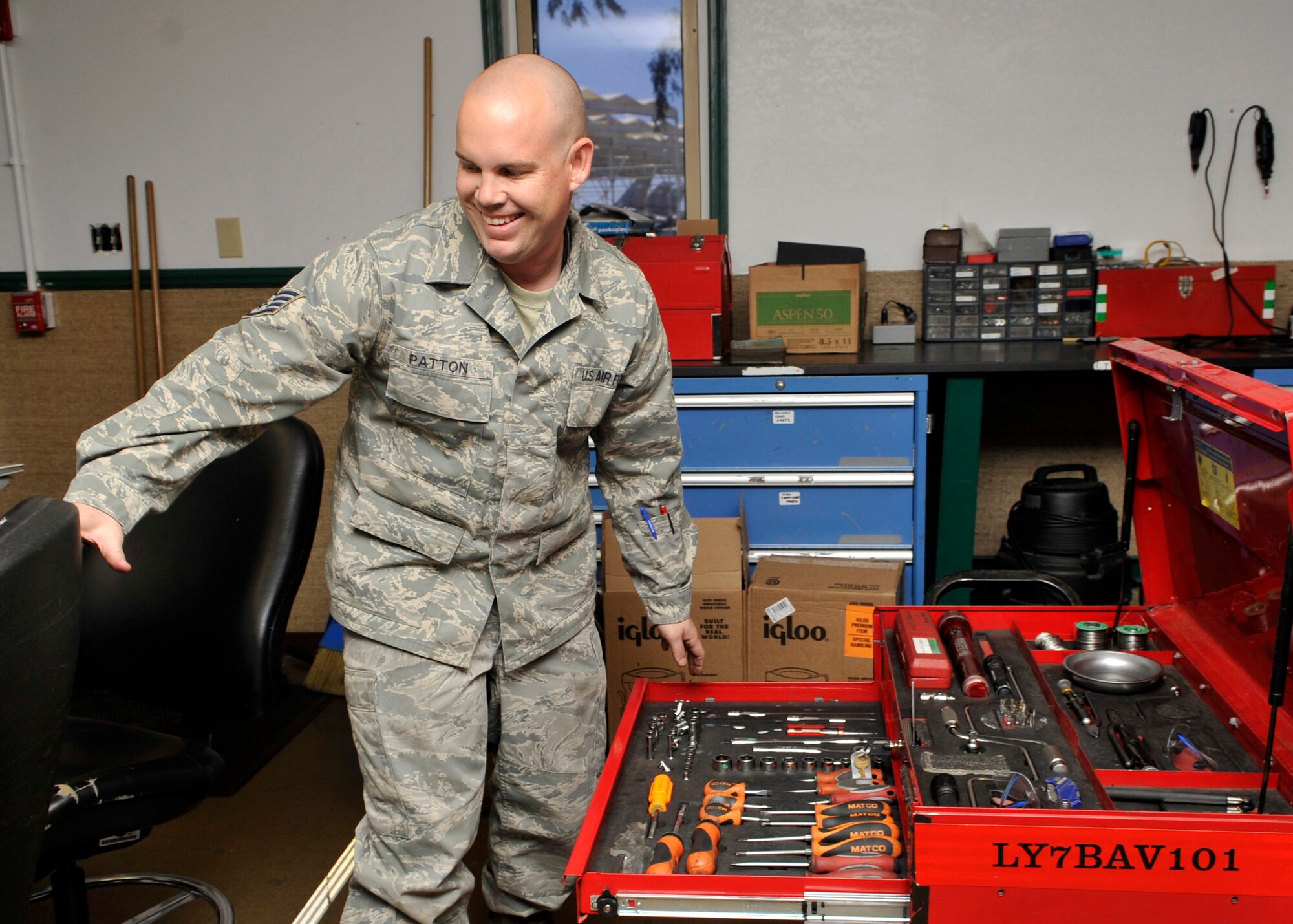 Staff Sgt. David Patton, 56th Aircraft Maintenance Squadron support section floor chief, repairs a tool box Aug. 6 on Luke Air Force Base. Patton administered life-saving CPR to Robert Clark and received an award from Mayor Sharon Wolcott of Surprise and the Surprise Fire and Paramedic Departments. (U.S. Air Force photo/Senior Airman Marcy Copeland)