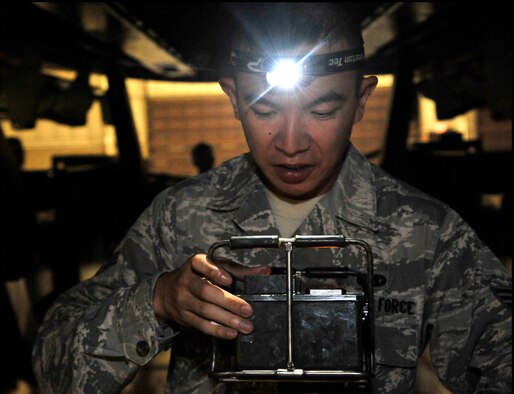 U.S. Air Force Senior Airman SiuYu Leung, 509th Aircraft Maintenance Squadron weapons load member, operates a portable control unit during a Global Strike Challenge practice Aug. 11, 2014 at Whiteman Air Force Base, Missouri. The Global Strike Challenge provides maintainers from across the command the opportunity to participate in innovative thinking, teamwork and esprit de corps that are central to the AFGSC’s mission. (U.S. Air Force photo by Airman 1st Class Keenan Berry/Released)