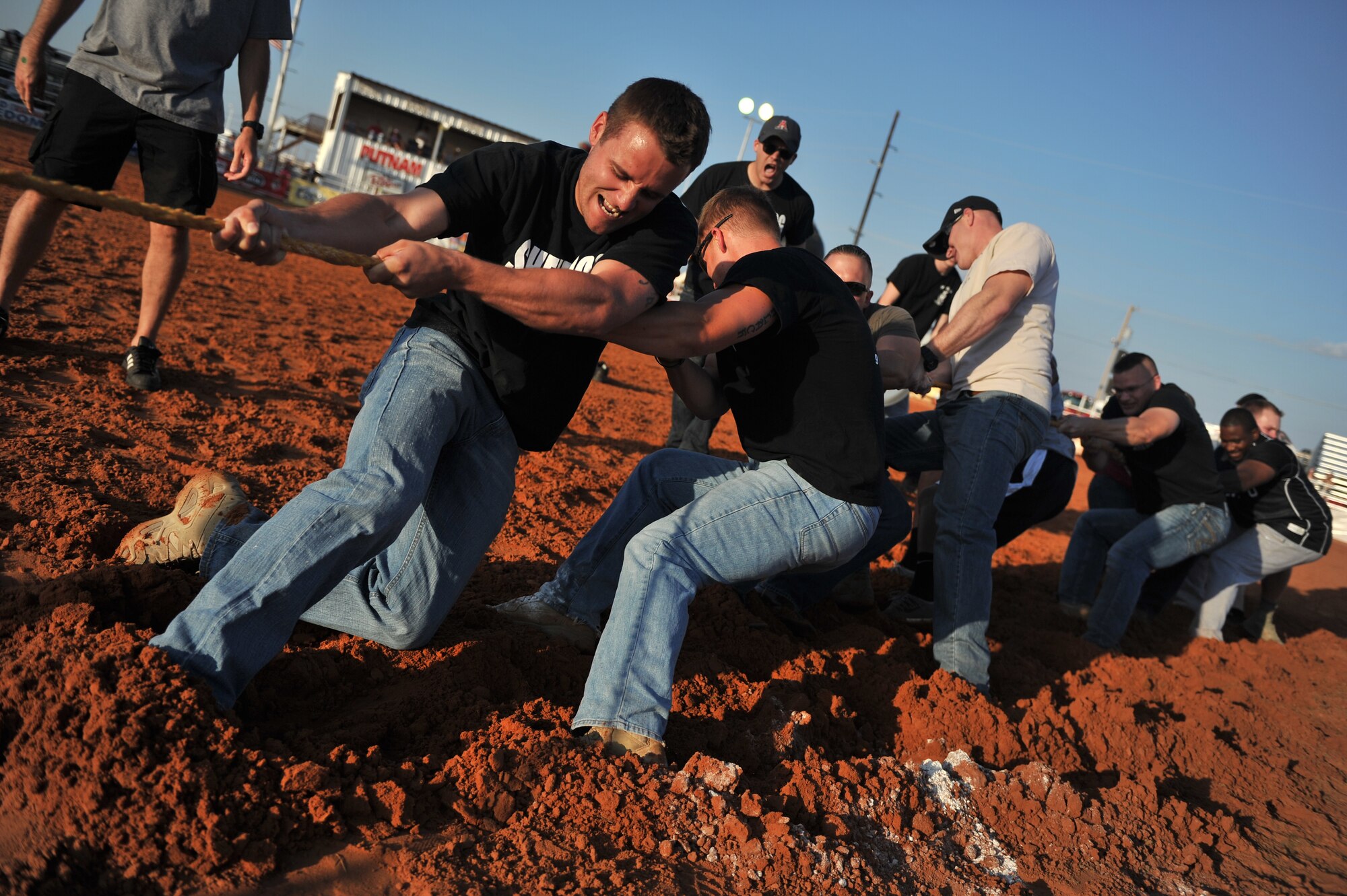 ALTUS, Okla. – Members of the 97th Security Forces Squadron, two-time reigning Tug-o-War champions, participate in the annual Tug-o-War competition at this year’s 36th Annual Great Plains Stampede Rodeo Aug. 21, 2014. Each year, organizations from Altus Air Force Base participate in the Tug-o-War competition as a part of the military appreciation and opening night for the rodeo. This year, members of the 97th Operations Group took home the trophy after beating the 97th Logistics Readiness Squadron and the 97th SFS. (U.S. Air Force photo by Senior Airman Dillon Davis/Released)