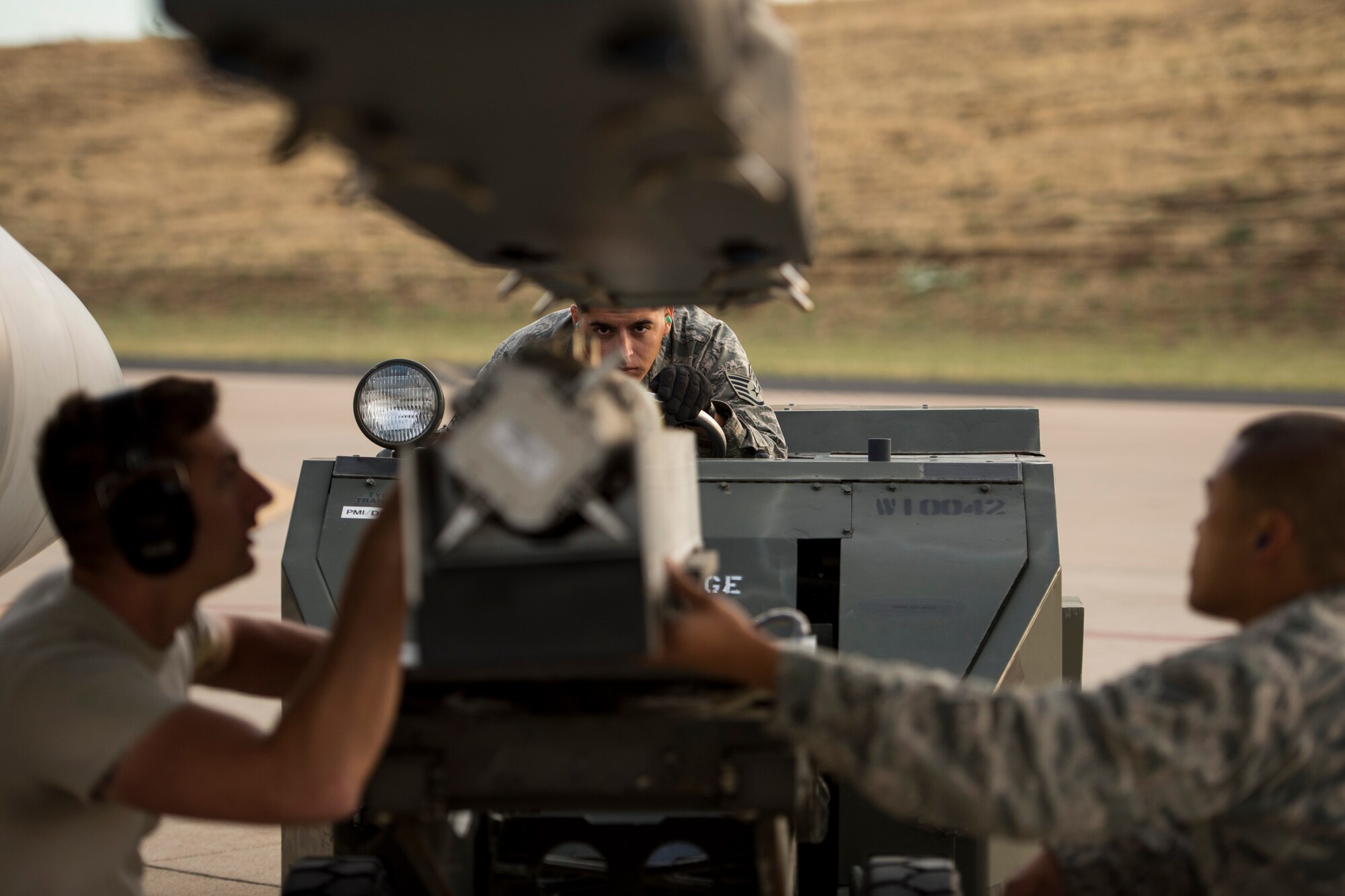 Senior Airman Jason Nonog, assigned to the 510th Fighter Wing, Aviano Air Base, Italy, prepares an F-16 Fighting Falcon for takeoff during an air-to-ground Weapons System Evaluation Program (WSEP) at Hill AFB, Utah, Aug. 13, 2014. WSEP is an annual training exercise where the effectiveness, maintainability, suitability and accuracy of guided munitions is evaluated. The 510th FW, as well as the 494th FW from Royal Air Force Lakenheath, England, joined the 388th Fighter Wing of Hill AFB, Utah. (U.S. Air Force photo by Airman 1st Class Taylor Queen)