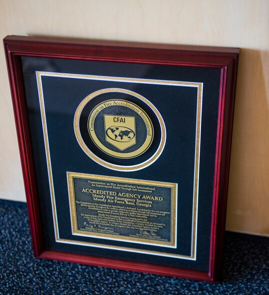 A Commission on Fire Accreditation International plaque rests at Moody Air Force Base, Ga., Aug. 21, 2014. Moody firefighters received the award and currently rank sixth in the Air Force in fire and rescue agencies within CFAI’s standrads. (U.S. Air Force photo by Airman 1st Class Ceaira Tinsley/Released)
