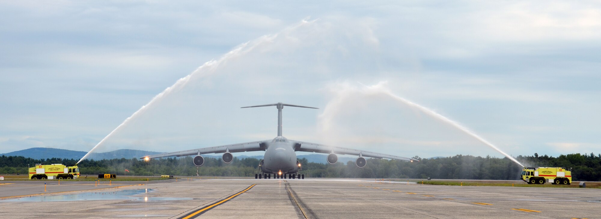 Brig. Gen. Steven Vautrain, 439th Airlift Wing commander, receives the traditional hosedown following his fini flight, Aug. 21, 2014. Brig. Gen. Vautrain will go to the nation’s capital where he’ll begin his new position at the Pentagon as deputy director of strategic planning for the Air Force.(U.S. Air Force photo/SSgt. Kelly Goonan)