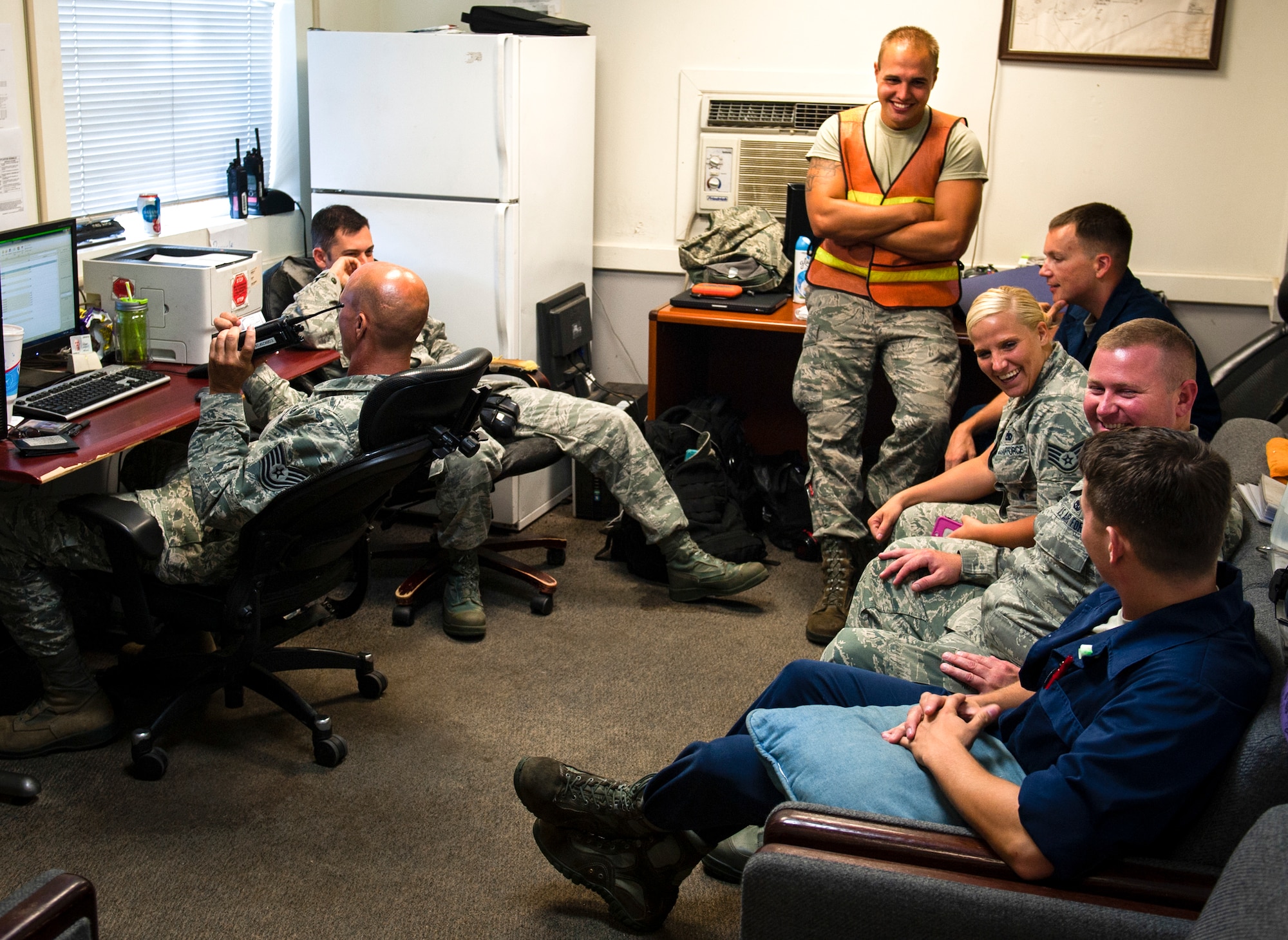 The end-of-runway crew takes a break in a tiny building at the end of the flight line at Eglin Air Force Base, Fla., Aug. 7.  The 96th Maintenance Group’s EOR crew is responsible for checking each aircraft for leaks, loose parts or any damage to the tires or aircraft before takeoffs and landings. (U.S. Air Force photo/Tech. Sgt. Jasmin Taylor)