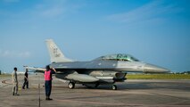 An Airman marshals in an F-16 Fighting Falcon for a final inspection from the end-of-runway crew at Eglin Air Force Base, Fla., Aug. 7.  The 96th Maintenance Group’s EOR crew is responsible for checking each aircraft for leaks, loose parts or any damage to the tires or aircraft before takeoffs and landings. (U.S. Air Force photo/Tech. Sgt. Jasmin Taylor)