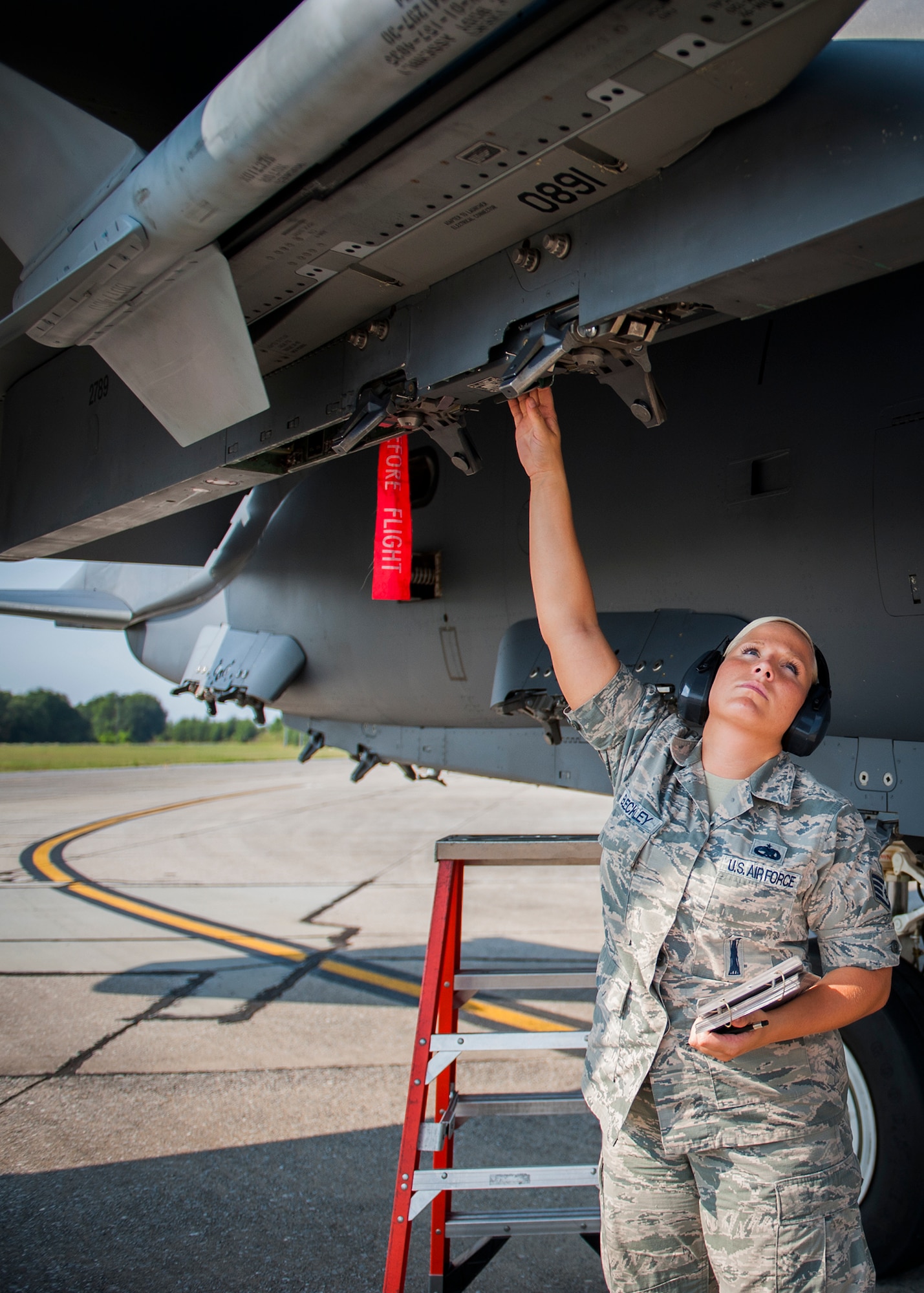 Staff Sgt. Lena Bleckley, 96th Aircraft Maintenance Squadron, arms the weapons at Eglin Air Force Base, Fla., Aug. 7.  The 96th Maintenance Group’s end-of-runway weapons crew is responsible for removing the safety pins from the jet’s munitions prior to take off and replacing them upon arrival. (U.S. Air Force photo/Tech. Sgt. Jasmin Taylor)