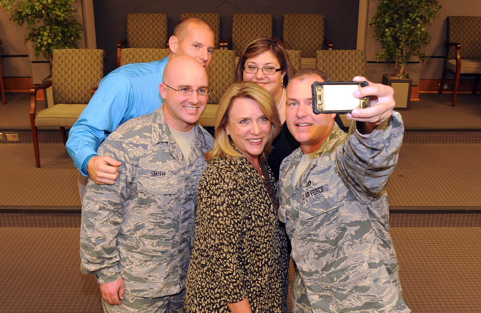 Secretary of the Air Force Deborah Lee James takes time out during her busy day of briefings to snap a "selfie" with a group of Air Force Reserve Command annual award winners. From left are Tech. Sgt. Ricky Smith, Philip Patisaul, James, Debra Garcia and Master Sgt. Chad Wagner. (U.S. Air Force photo by Tommie Horton) 