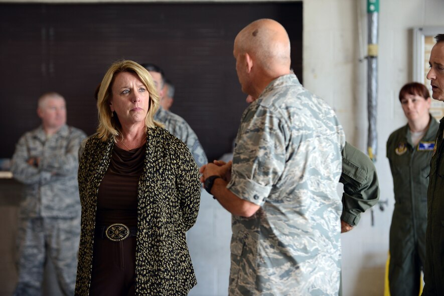 Secretary of the Air Force Deborah Lee James receives a briefing from Col. Kelly Scott, 461st Maintenance Group commander, during a tour of the 461st and 116th Air Control wings at Robins Air Force Base, Ga. Aug. 21, 2014. Representatives from both units discussed mission capabilities and challenges associated with the aging airframe. (U.S. Air Force photo by Tommie Horton) 