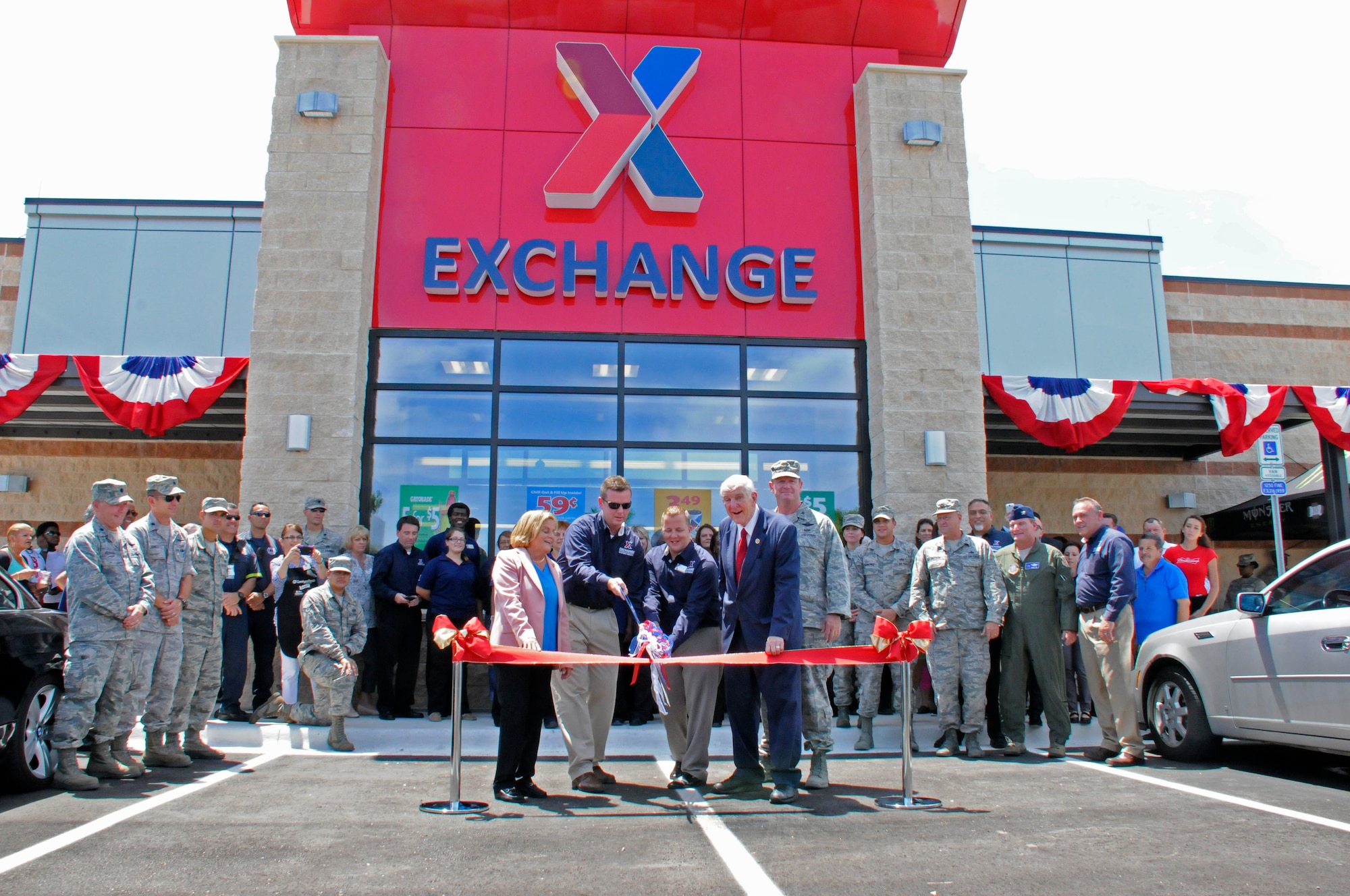 The Army Air Force Exchange Service Express is officially opened during a ribbon cutting at Homestead Air Reserve Base, Fla., Aug. 20. The AAFES Express is a 10,500 square foot facility that includes military clothing, four-pump gas station and convenience store. (Air Force photo/Senior Airman Nicolas Caceres)