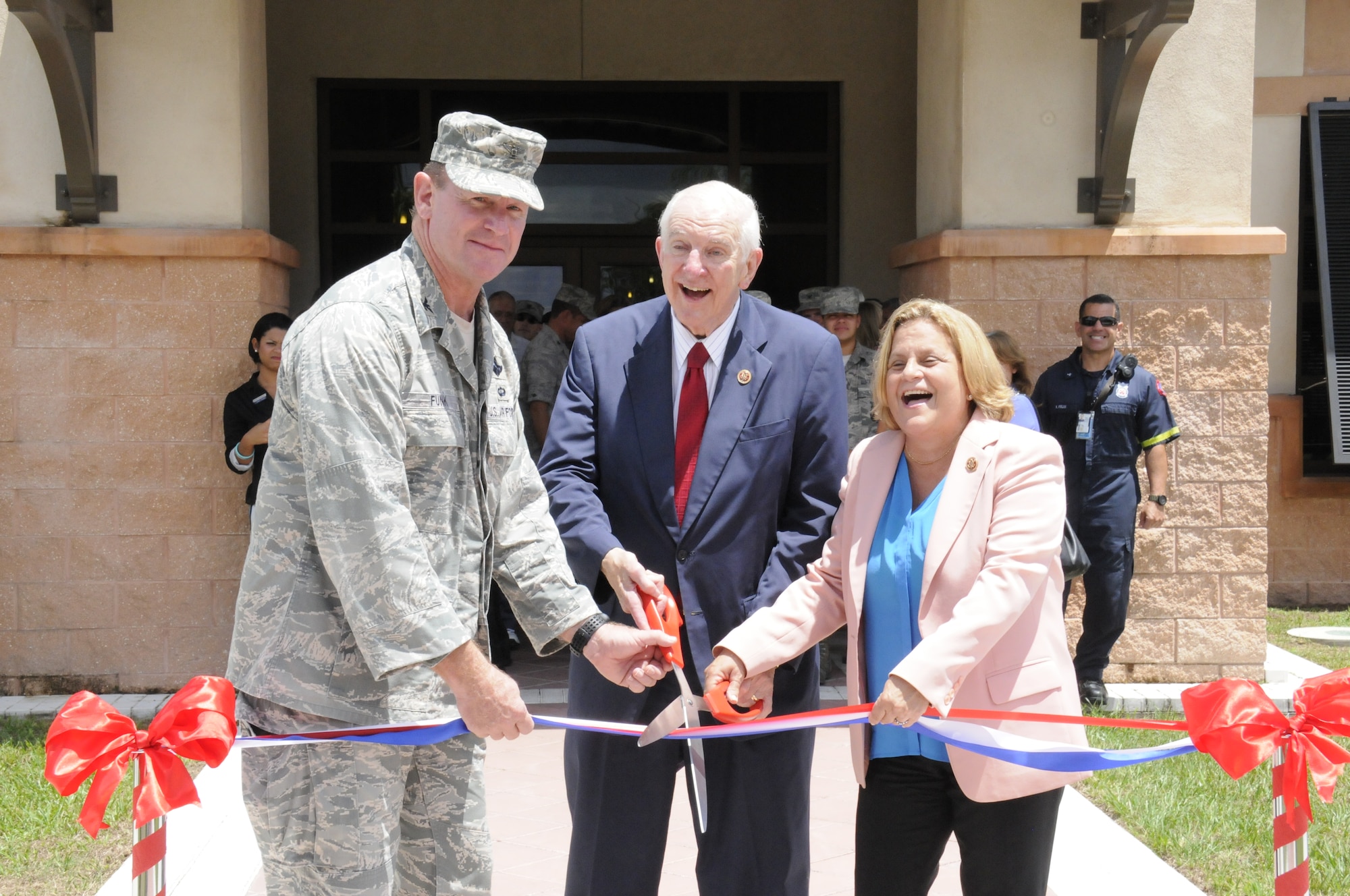 Congressman Sam Johnson, representing the 3rd District of Texas, Congresswoman Ileana Ros-Lehtinen, representing Florida’s 27th Congressional District, and Col. Chris Funk, 482nd Fighter Wing commander, cut the ribbon on the new Community Activity Center. Two brand-new facilities and the newly renovated Sam Johnson Fitness Center were officially opened during a ribbon cutting event Aug. 20 at Homestead Air Reserve Base. (Air Force photo/Senior Airman Nicolas Caceres)