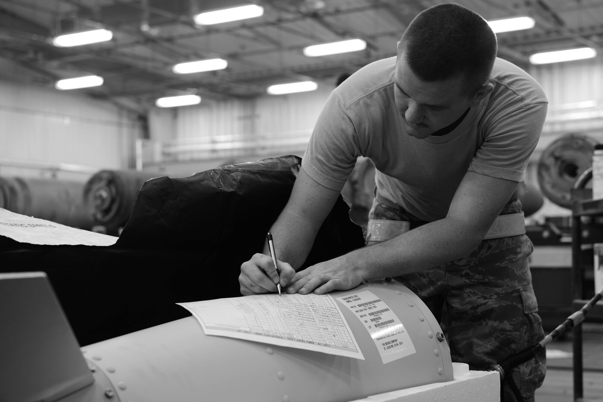 U.S. Air Force Senior Airman Mitchel Pearson, 379th Expeditionary Maintenance Squadron munitions crewchief, tests kit munitions unit telecommunications at Al Udeid Air Base, Qatar, Aug. 20, 2014. The testing is necessary to ensure that the newly received KMU is compatible and works with any new updates that may have been added to the inventory. (U.S. Air Force photo by Staff Sgt. Ciara Wymbs)
