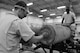 U.S. Air Force Airmen 1st Class Joseph Williams and Carvell McCullough, 379th Expeditionary Maintenance Squadron conventional maintenance crewmembers load a fuse into a guided bomb unit at Al Udeid Air Base, Qatar, Aug. 20, 2014. A GBU is a precision-guided munition designed to achieve greater accuracy. Both Airmen are deployed from Dyess Air Force Base, Texas. Williams hails from Houston and McCullough is from Oklahoma City. (U.S. Air Force photo by Staff Sgt. Ciara Wymbs)
