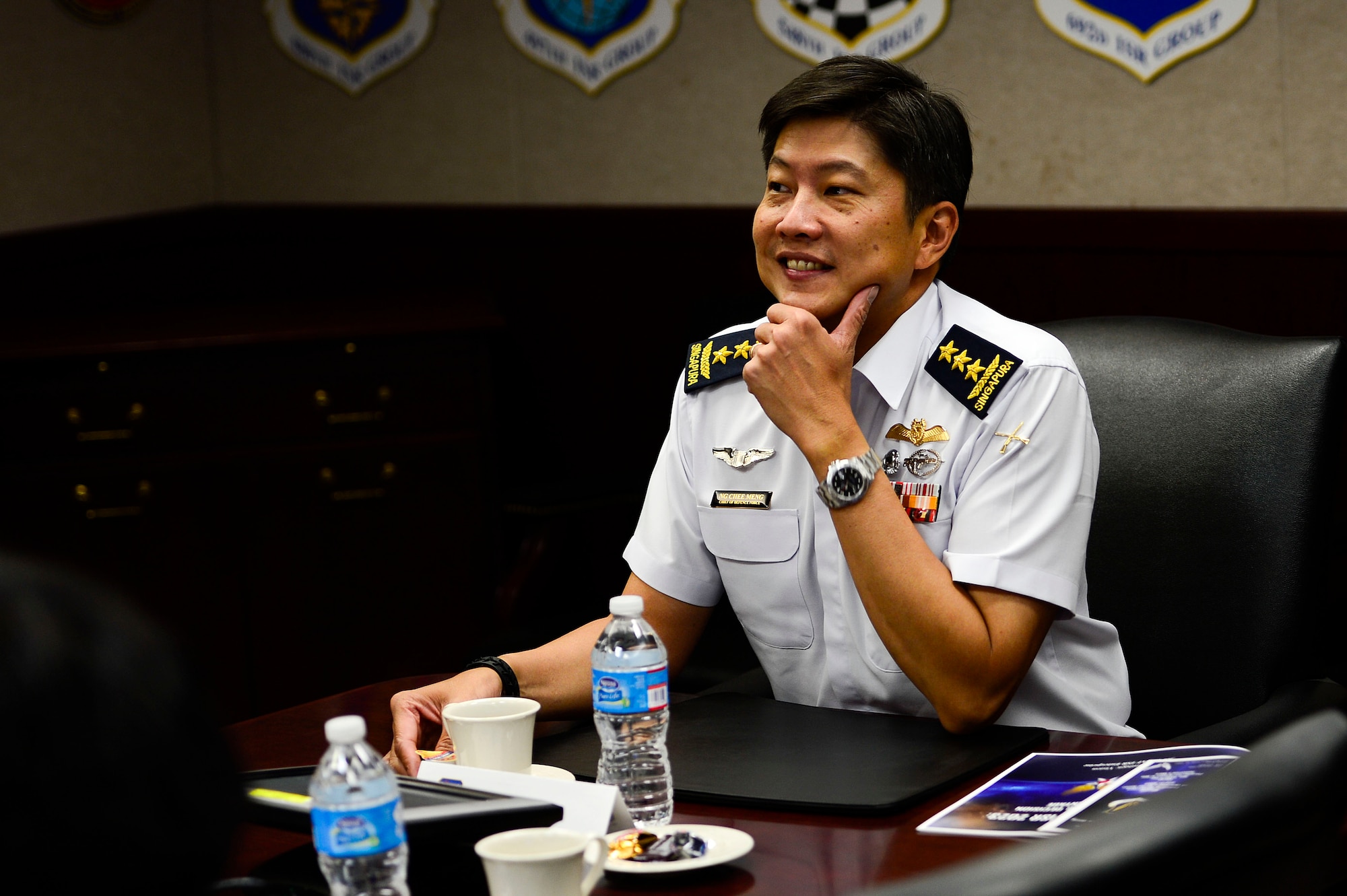 Republic of Singapore Air Force Lt. Gen. Ng Chee Meng, Chief of Defense Force, attends a briefing from the 480th Intelligence Surveillance Reconnaissance Wing commander at Langley Air Force Base, Va., Aug. 20, 2014. Ng’s visit included a tour of the 480th ISR operations floor, as well as a tour of the Training Brain Operations Center in Newport News, Va. (U.S. Air Force photo by Senior Airman Kayla Newman/Released) 