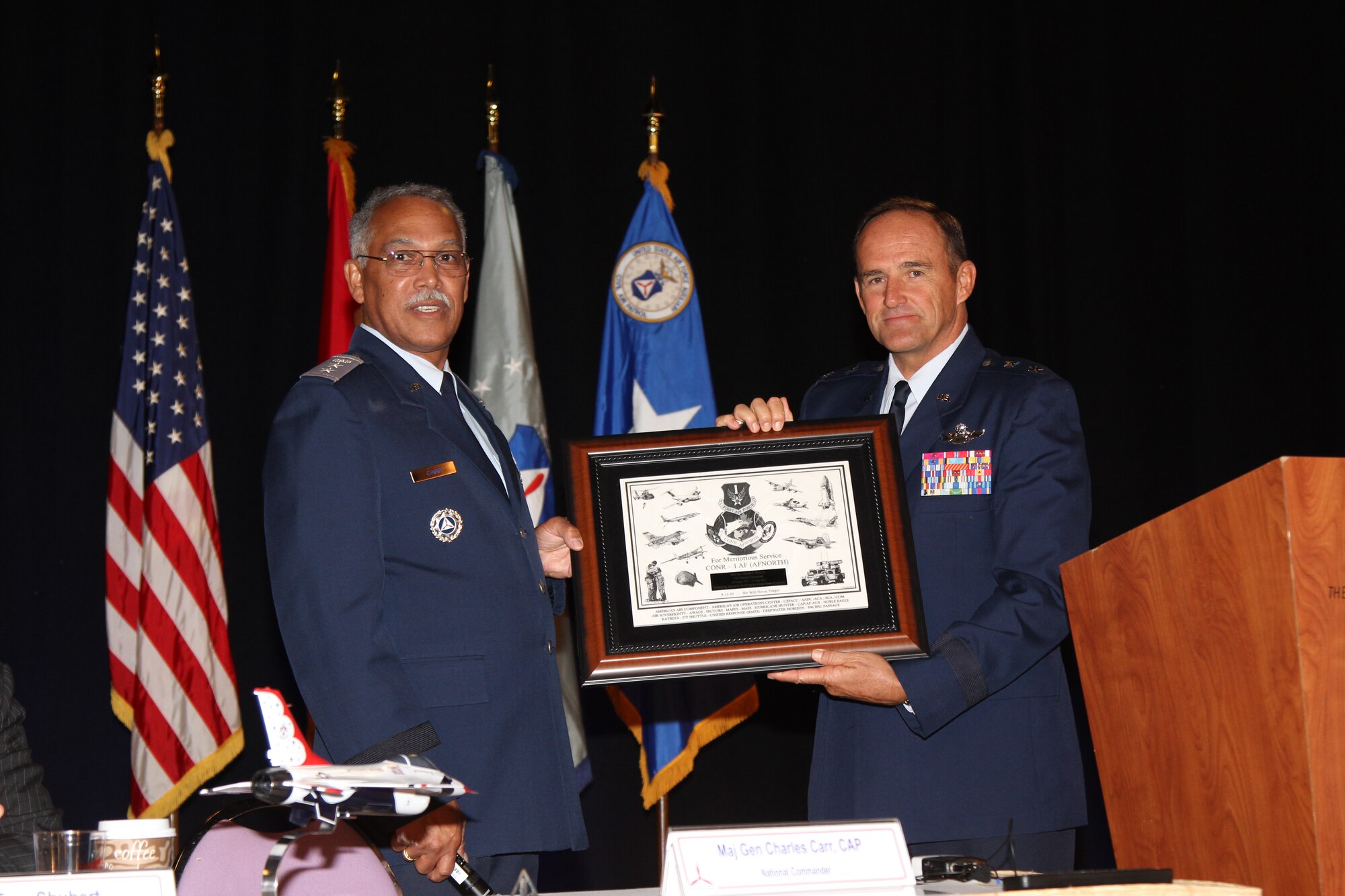 Maj. Gen. Chuck Carr, (Left)former Civil Air Patrol National Commander, receives the Air  Forces  Northern Commander’s Meritorious Service Award from Maj. Gen. Trulan Eyre, Air National Guard Assistant to the Commander, Continental U.S. Northern Aerospace Defense Region-1st Air Force (AFNORTH) during a change of command ceremony August 15 as part of CAP’s 2014 National Conference in Las Vegas, Nev.  Carr received the award in recognition of his three-year tenure as CAP National Commander.  (Photo by Susan Schneider/CAP National Headquarters)
