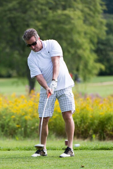 BEDFORD, Mass. – Retired Chief Master Sgt. Michael Boudreau, 66th Force Support Squadron Manpower and Personnel Flight chief, tees off during the Chief's Group Golf Tournament at the Patriot Golf Course Aug. 21. The chief's, along with the Top 3, hosted the tournament to raise funds to support enlisted personnel from all services in New England. (U.S. Air Force photo by Mark Herlihy)